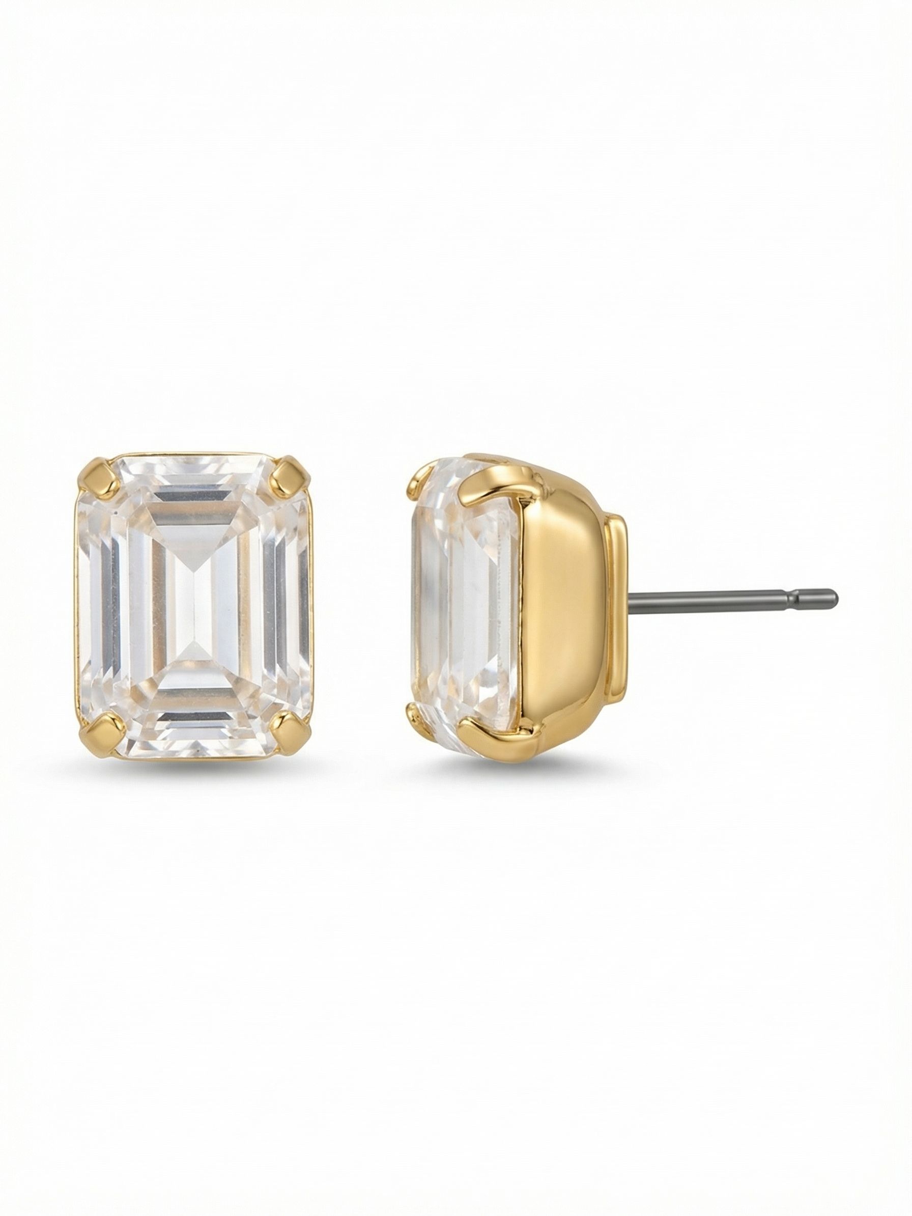 Octavia Stud Earrings - EDU53BGCRY - <p>A single emerald-cut crystal offers a quiet, geometric take on daily polish. The stepped facets draw light inward, creating deep, linear reflections that read clearly even from a conversation away. Set in warm gold-tone, this tailored stud carries enough weight to stand alone. An oversized comfort clutch provides secure balance, keeping the stone upright and properly positioned from your first cup of coffee to the evening commute.</p><ul>
<li>Emerald-cut facets create clean, linear flashes of light</li>
<li>Substantial geometric scale reads clearly from across a table</li>
<li>Post with oversized comfort-clutch back</li>
<li>Protective e-coat finish for lasting wear</li>
<li>Includes signature organza pouch for gifting and travel</li>
</ul>
