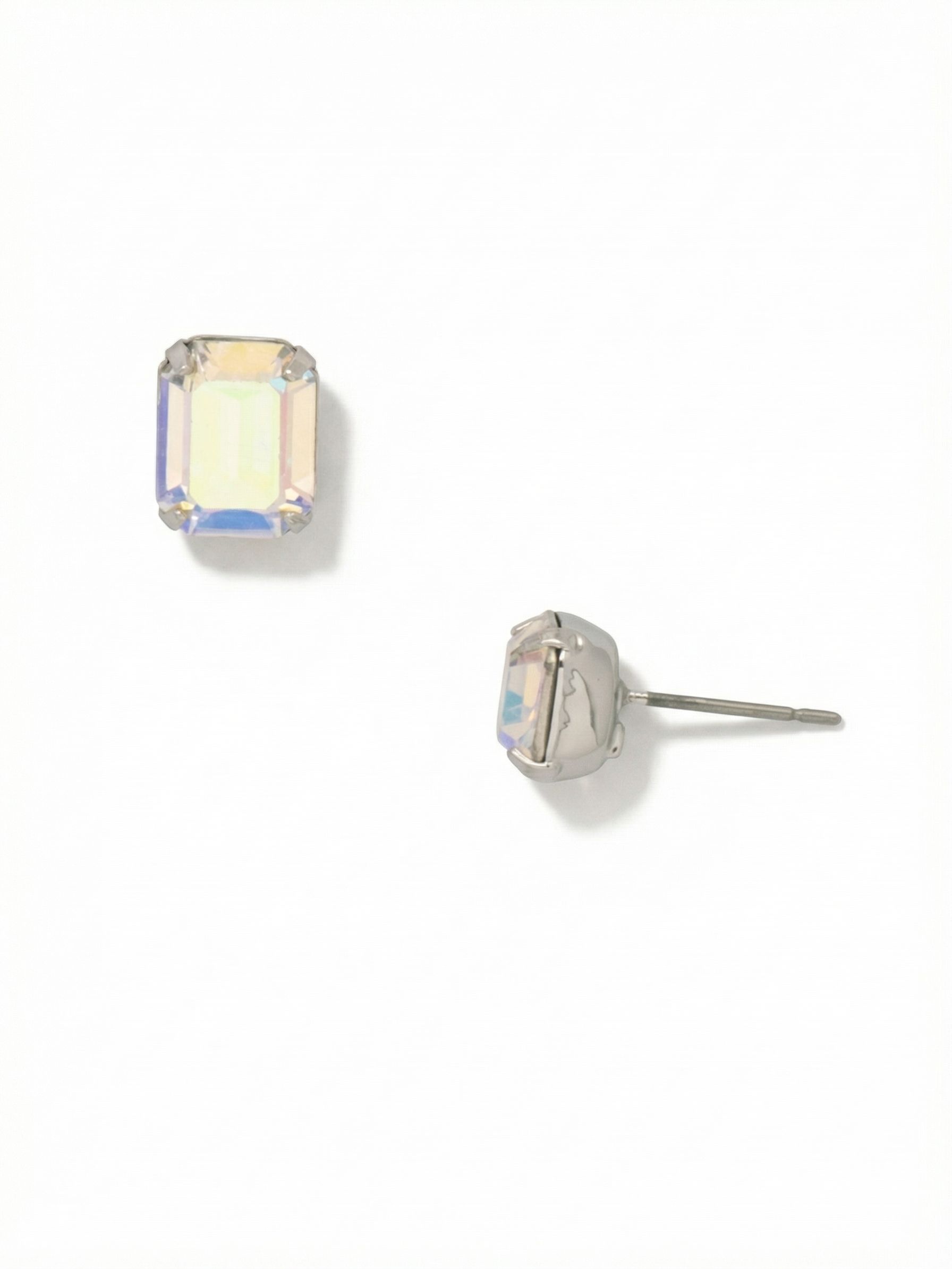 Octavia Stud Earrings - EDU53PDCAB - <p>A single emerald-cut crystal creates a refined silhouette that reads clearly from across the room. The clean step cuts contrast with the shifting iridescence, catching varied light as you turn your head. At half an inch wide, they offer a substantial presence without feeling heavy. We include an oversized comfort clutch with the post, keeping the crystal secure and perfectly upright all day so you never have to adjust the setting.</p><ul>
<li>Architectural emerald cut provides a clean geometric profile</li>
<li>Step-cut facets create sharp color shifts in changing light</li>
<li>Post with oversized comfort-clutch back</li>
<li>Protective e-coat finish for lasting wear</li>
<li>Includes signature organza pouch for gifting and travel</li>
</ul>