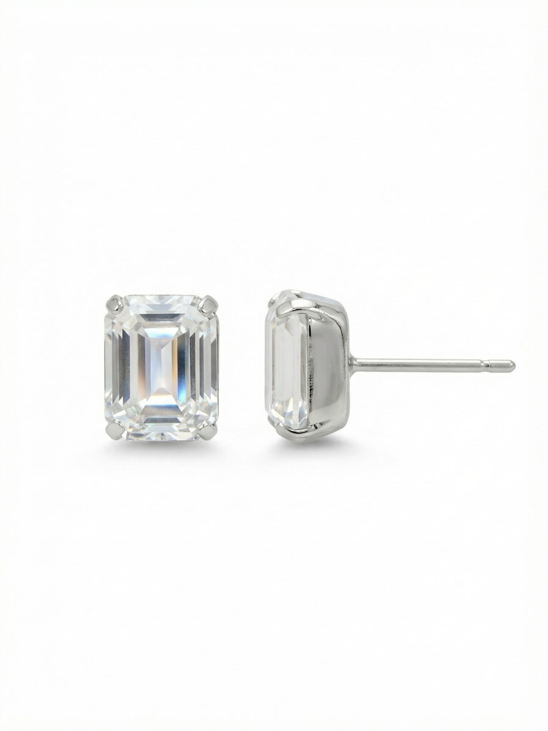 Octavia Stud Earrings - EDU53PDCRY - <p>A sharply faceted emerald-cut crystal defines this minimalist stud. Set in cool palladium, the clear step-cut stone catches light with quiet precision. It offers a clean architectural shape that reads distinctly even from across a table. The half-inch scale gives it enough presence to wear alone while remaining streamlined enough to anchor a second piercing. An oversized comfort clutch keeps the post perfectly balanced and secure, ensuring the piece remains unnoticeable as you move through your day.</p><ul>
<li>Emerald-cut shape offers a sharp architectural profile</li>
<li>Step-cut faceting creates precise geometric flashes of light</li>
<li>Post with oversized comfort-clutch back</li>
<li>Protective e-coat finish for lasting wear</li>
<li>Includes signature organza pouch for gifting and travel</li>
</ul>