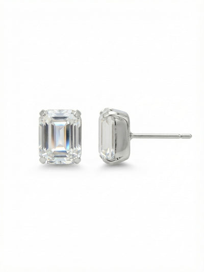 Octavia Stud Earrings - EDU53PDCRY - <p>A sharply faceted emerald-cut crystal defines this minimalist stud. Set in cool palladium, the clear step-cut stone catches light with quiet precision. It offers a clean architectural shape that reads distinctly even from across a table. The half-inch scale gives it enough presence to wear alone while remaining streamlined enough to anchor a second piercing. An oversized comfort clutch keeps the post perfectly balanced and secure, ensuring the piece remains unnoticeable as you move through your day.</p><ul>
<li>Emerald-cut shape offers a sharp architectural profile</li>
<li>Step-cut faceting creates precise geometric flashes of light</li>
<li>Post with oversized comfort-clutch back</li>
<li>Protective e-coat finish for lasting wear</li>
<li>Includes signature organza pouch for gifting and travel</li>
</ul>