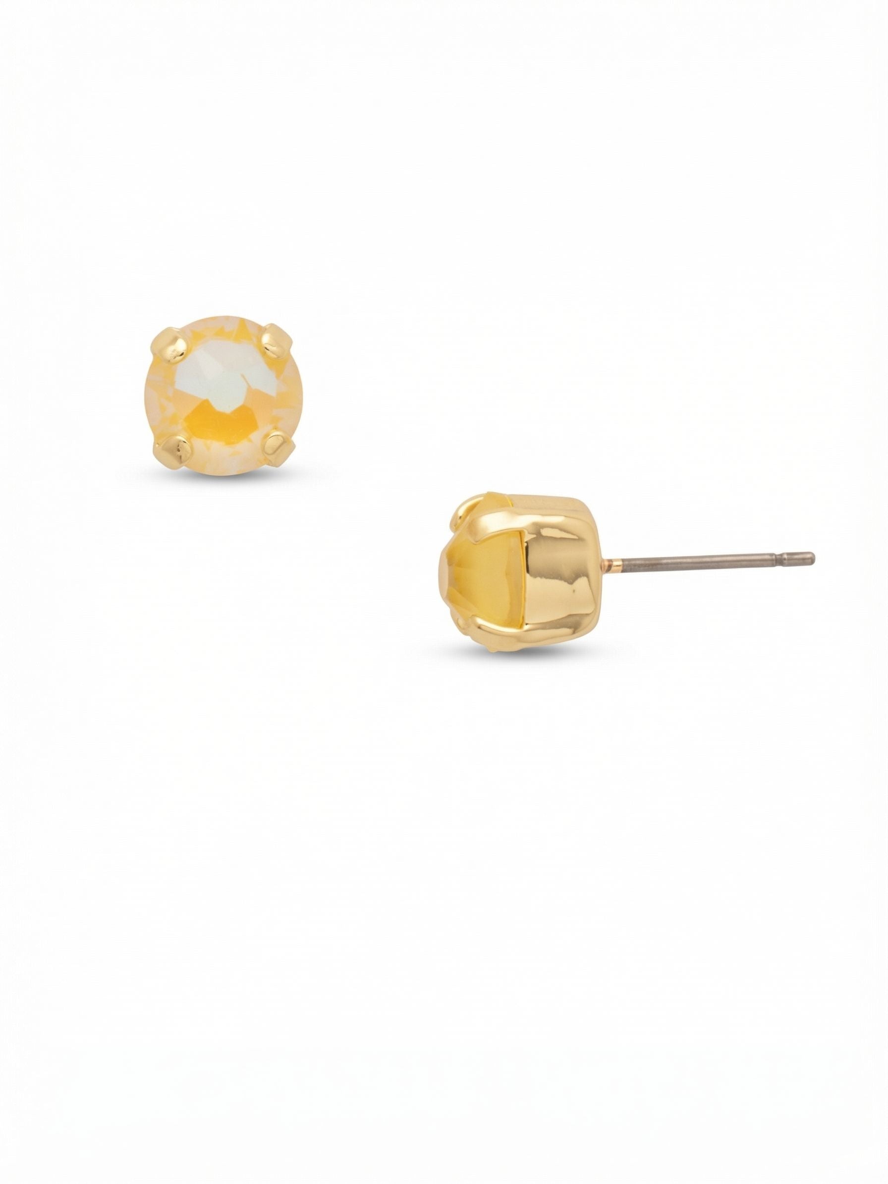 Simple Stud Earrings - EFC99BGLTD - <p>A single round-cut crystal in warm Light Topaz Delite provides a subtle wash of color that reads clearly from across a table. Set in a classic prong setting, this stud offers a low-profile presence for daily wear. The included oversized comfort clutch keeps the piece securely anchored all day without pinching.</p><ul>
<li>Single round-cut crystal in a traditional four-prong setting</li>
<li>Low-profile silhouette designed for seamless daily wear</li>
<li>Post with oversized comfort-clutch back</li>
<li>Protective e-coat finish for lasting wear</li>
<li>Includes signature organza pouch for gifting and travel</li>
</ul>