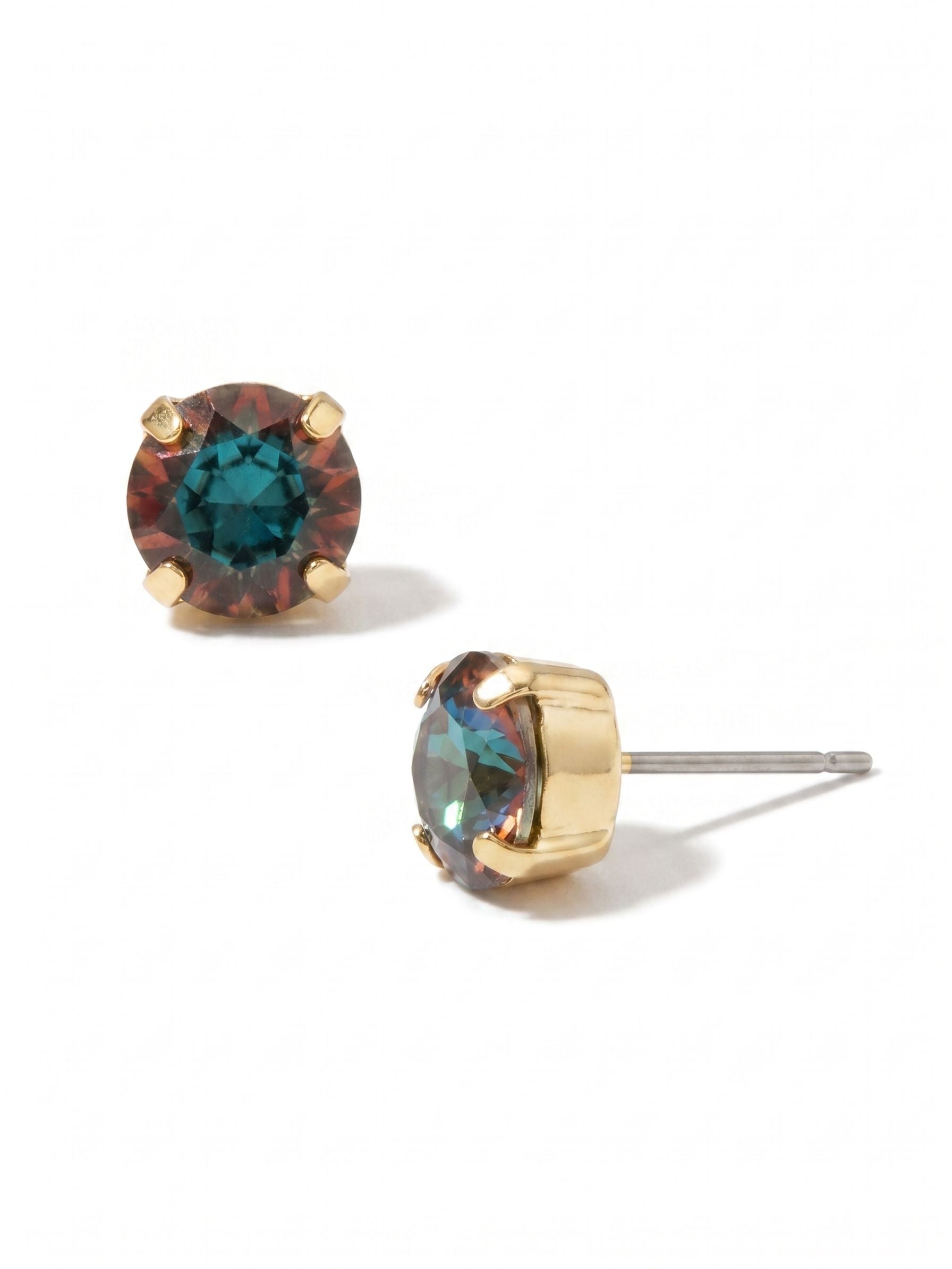 Simple Stud Earrings - EFC99BGVO - <p>A single round-cut crystal brings a constant shift of deep teal and warm amber tones to your daily rotation. The bright gold setting creates a clean frame that catches the light naturally. Finished with an oversized comfort clutch backing, this lightweight piece stays secure and properly positioned from morning until night.</p><ul>
<li>Single round crystal cut to maximize color shift and light play</li>
<li>Minimalist four-prong setting allows the stone to remain the focal point</li>
<li>Post with oversized comfort-clutch back</li>
<li>Protective e-coat finish for lasting wear</li>
<li>Includes signature organza pouch for gifting and travel</li>
</ul>