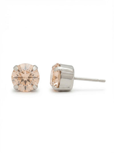 Simple Stud Earrings - EFC99PDSIL - <p>The pale peach warmth of a single round crystal contrasts nicely with its cool silver-tone setting. Sized at just under half an inch, this piece holds a steady presence at conversation distance without feeling weighty. An oversized comfort clutch back keeps the stone perfectly positioned and secure, making it an easy choice for daily wear.</p><ul>
<li>Classic four-prong setting holding a single round-cut crystal</li>
<li>Soft pale peach hue pairs effortlessly with neutral tones</li>
<li>Post with oversized comfort-clutch back</li>
<li>Protective e-coat finish for lasting wear</li>
<li>Includes signature organza pouch for gifting and travel</li>
</ul>
