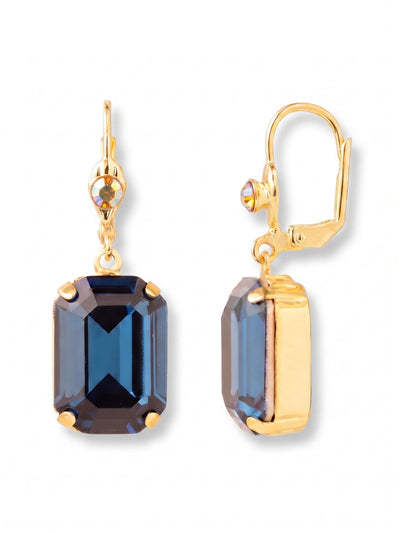 Kathleen Studded Dangle Earrings - EFF80BGDNM - <p>A pinpoint of iridescent crystal rests near the ear, catching ambient light before dropping to a substantial deep blue stone. The clean stepped facets of the emerald cut create broad flashes of color that shift with your natural movement. Suspended from a secure latching wire, the weight feels balanced and comfortable for all-day wear. The rich tone brings a grounded polish to a crisp white shirt or a familiar pair of jeans.</p><ul>
<li>Deep emerald-cut crystals offer broad flashes of rich color</li>
<li>Articulated drop design allows the lower stone to swing freely</li>
<li>French wire for a smooth, secure fit</li>
<li>Protective e-coat finish for lasting wear</li>
<li>Includes signature organza pouch for gifting and travel</li>
</ul>