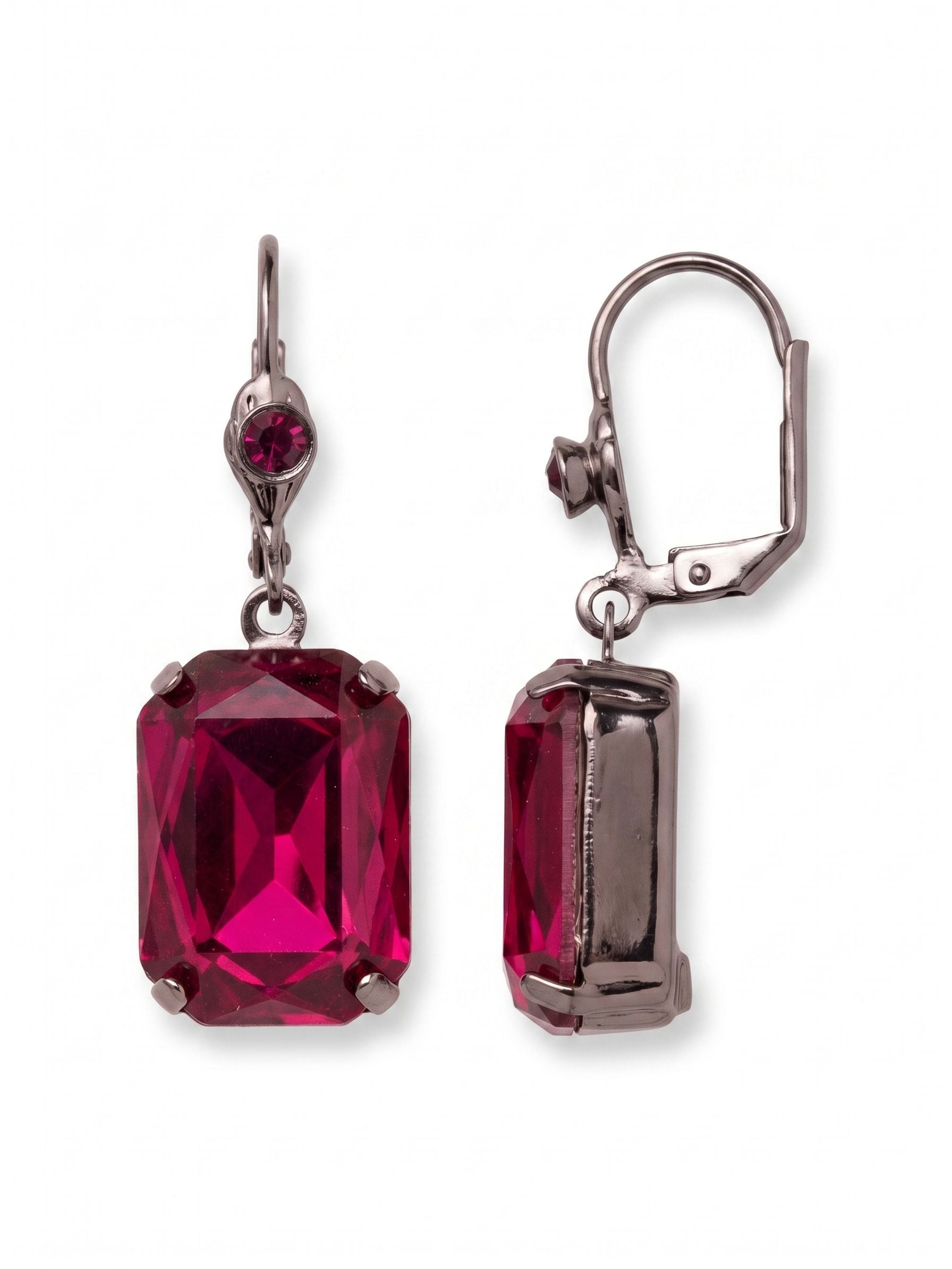 Kathleen Studded Dangle Earrings - EFF80GMFU - <p>A saturated rush of color suspended just below the ear. A single emerald-cut fuchsia crystal anchors each earring, catching the light with every slight turn of your head. The deep gunmetal setting creates a strong contrast, bringing out the intense pink hues of the stone. Finished with a secure lever-style closure that clicks gently into place, keeping the weight comfortably balanced from morning meetings to late dinners.</p><ul>
<li>Large emerald-cut center crystal suspended beneath a round-cut accent stone</li>
<li>Deep gunmetal settings emphasize the highly saturated pink color</li>
<li>French wire for a smooth, secure fit</li>
<li>Includes signature organza pouch for gifting and travel</li>
</ul>