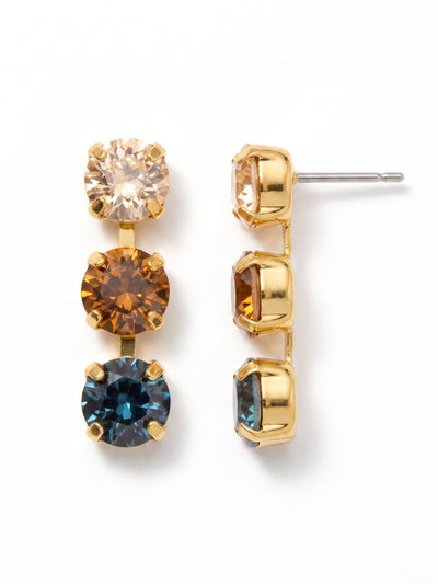 Matilda Triple Dangle Earrings - EFH10BGDNM - <p>Three distinct round crystals descend in a neat vertical line, shifting from warm champagne into deep amber and finishing with a flash of dark blue. The flexible kette chain construction allows each stone to catch the light independently as you walk. To keep the design perfectly upright, these post earrings include an oversized comfort clutch that supports the weight from behind, ensuring the linear drop stays balanced and secure all day.</p><ul>
<li>Flexible chain construction allows each round crystal to move independently</li>
<li>Gradient color arrangement shifts from warm champagne down to dark blue</li>
<li>Post with oversized comfort-clutch back</li>
<li>Protective e-coat finish for lasting wear</li>
<li>Includes signature organza pouch for gifting and travel</li>
</ul>