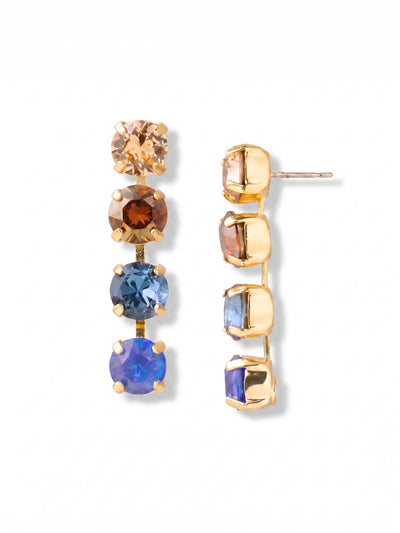 Matilda Dangle Earrings - EFH1BGDNM - <p>Four round-cut crystals align in a clean vertical drop, catching the light naturally as you move. The stones transition from a soft golden tan through rich amber down to deep, saturated blues, echoing the familiar balance of indigo and warm neutrals. Anchored by the topmost stone, the linear silhouette frames the face with subtle structure. To keep the design perfectly upright and balanced throughout your day, we include an oversized comfort clutch on the post.</p><ul>
<li>Graduated color palette moving from warm amber to cool deep blue</li>
<li>Clean linear silhouette built from four equally sized round-cut crystals</li>
<li>Post with oversized comfort-clutch back</li>
<li>Protective e-coat finish for lasting wear</li>
<li>Includes signature organza pouch for gifting and travel</li>
</ul>