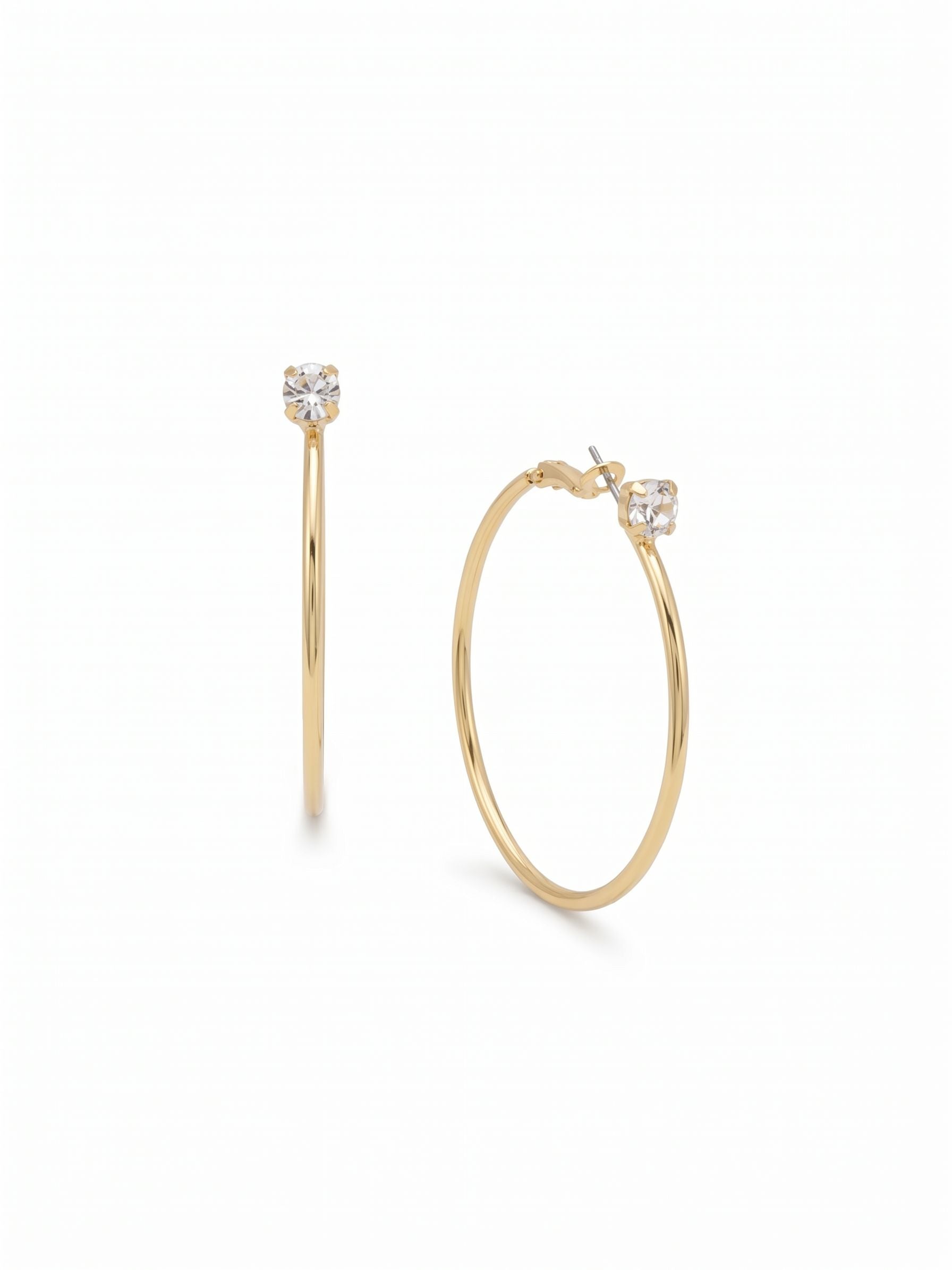 Mini Serafina Hoop Earrings - EFJ1BGCRY - <p>A slender gold hoop anchored by a single round crystal. The metal is lightweight enough for continuous comfort, moving gently as you walk. The clear stone catches light right at the top of the hoop, adding a quiet flash to an otherwise minimalist design. At an inch and a half across, these earrings offer enough scale to be noticed from across a room while maintaining a clean, barely-there profile in your daily rotation.</p><ul>
<li>Ultra-slim metal profile for a clean minimalist look</li>
<li>Single round clear crystal positioned at the top anchor</li>
<li>Hinged hoop with click-shut closure</li>
<li>Protective e-coat finish for lasting wear</li>
<li>Includes signature organza pouch for gifting and travel</li>
</ul>