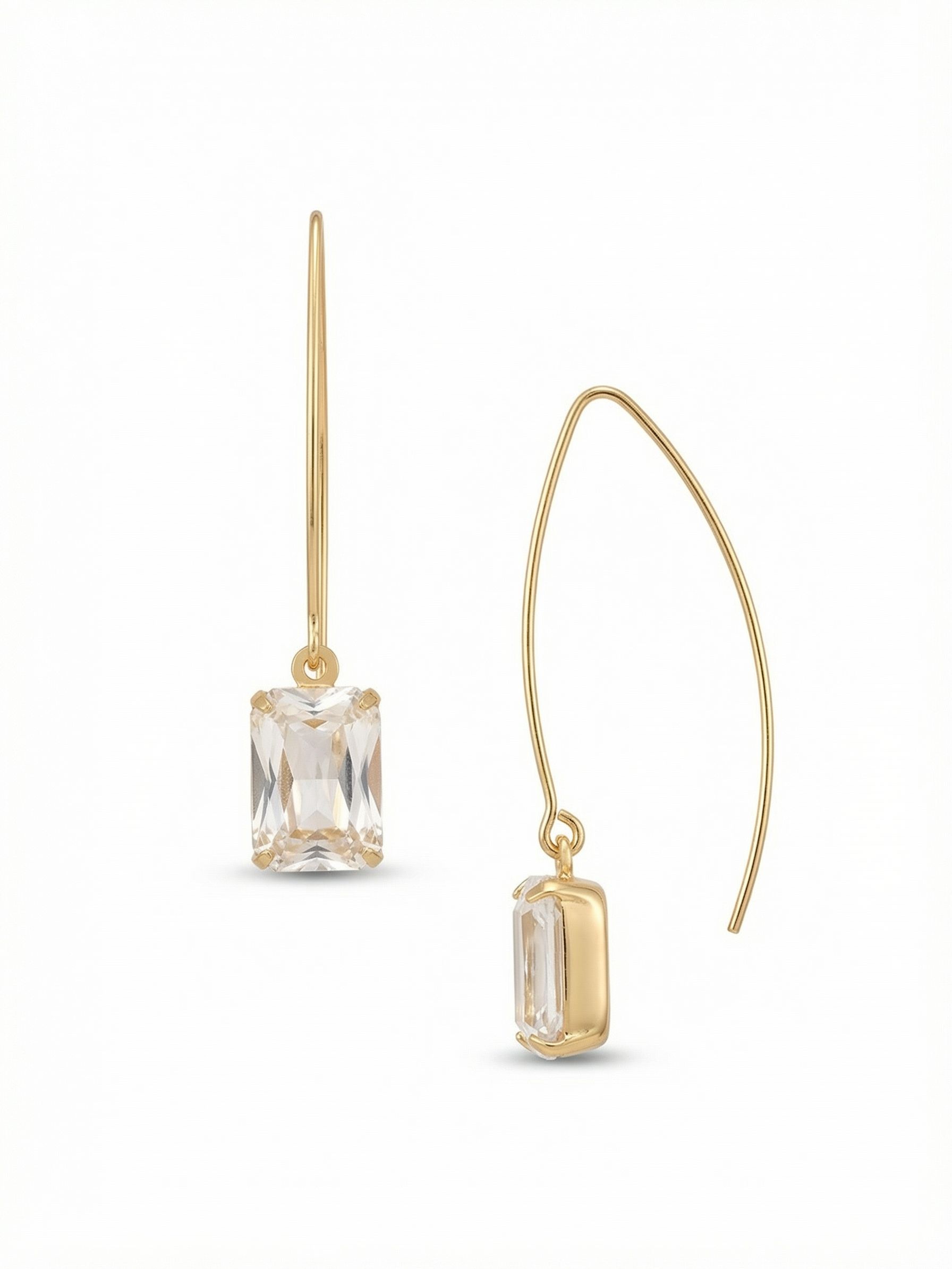 Bobbi Threader Dangle Earrings - EFK40BGCRY - <p>An elongated, curved wire slips cleanly through the piercing, anchoring a single, moderate emerald-cut crystal. The architecture here is intentionally minimal, allowing the clear geometric facets to catch ambient light naturally. The long, balanced wire provides a secure, lightweight feel while giving the stone room for a gentle, rhythmic swing. It is an uncomplicated design that transitions seamlessly from morning routines to evening plans, relying entirely on clean lines rather than complex layers.</p><ul>
<li>Moderate emerald-cut crystal suspended from a minimalist geometric arc</li>
<li>Elongated threader profile provides gentle movement and clean lines</li>
<li>Hook drop for easy, lightweight wear</li>
<li>Protective e-coat finish for lasting wear</li>
<li>Includes signature organza pouch for gifting and travel</li>
</ul>