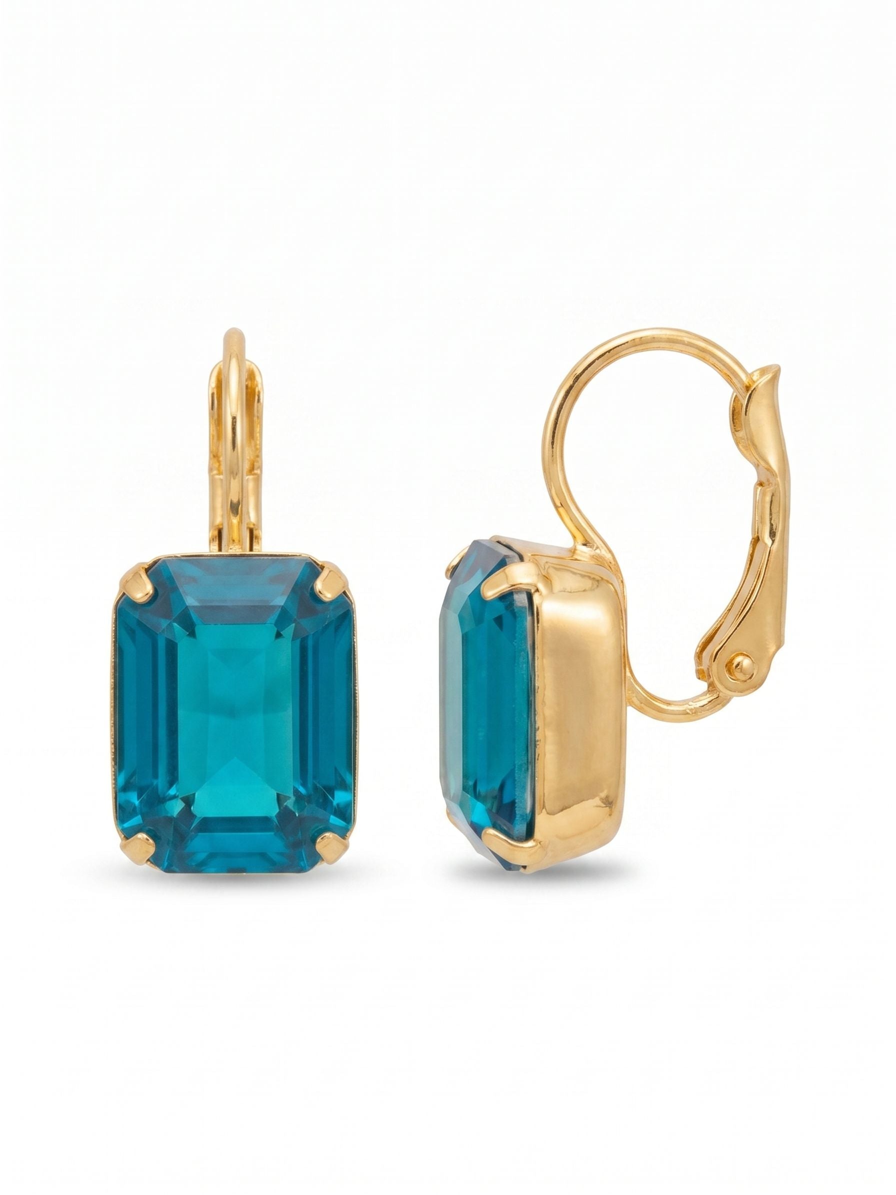 Octavia Dangle Earrings - EFK6BGCBO - <p>A single emerald-cut crystal delivers a vibrant wash of oceanic color. The clean, stepped facets offer a quiet geometry that feels refined rather than loud. Warmed by a bright gold-tone setting, the vivid blue opal hue captures the light beautifully as you move. Dropping just beneath the ear, they provide a gentle sway and a lightweight feel, anchored by a hinged wire that keeps them secure and comfortable long after the day is done.</p><ul>
<li>Vivid oceanic hue showcased in a geometric step cut</li>
<li>Close-wearing drop profile designed for gentle sway</li>
<li>Hook drop for easy, lightweight wear</li>
<li>Protective e-coat finish for lasting wear</li>
<li>Includes signature organza pouch for gifting and travel</li>
</ul>