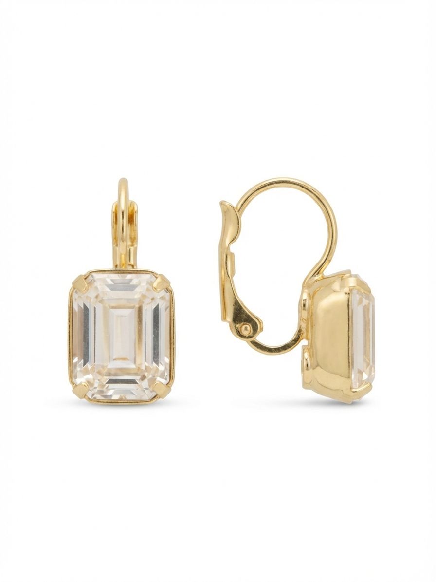 Octavia Dangle Earrings - EFK6BGCRY - <p>A single emerald-cut crystal drops lightly from a secure wire, catching daylight in its deep step facets. The linear cuts of the clear stone create crisp architectural reflections that soften against the bright gold-tone setting. Built on quiet geometry and natural movement, this piece brings a steady rhythm to your daily routine. It serves as a subtle focal point that feels entirely considered and comfortably effortless for constant wear.</p><ul>
<li>Single emerald-cut crystal with deep linear facets</li>
<li>Minimalist drop design for constant light reflection</li>
<li>Hook drop for easy, lightweight wear</li>
<li>Protective e-coat finish for lasting wear</li>
<li>Includes signature organza pouch for gifting and travel</li>
</ul>