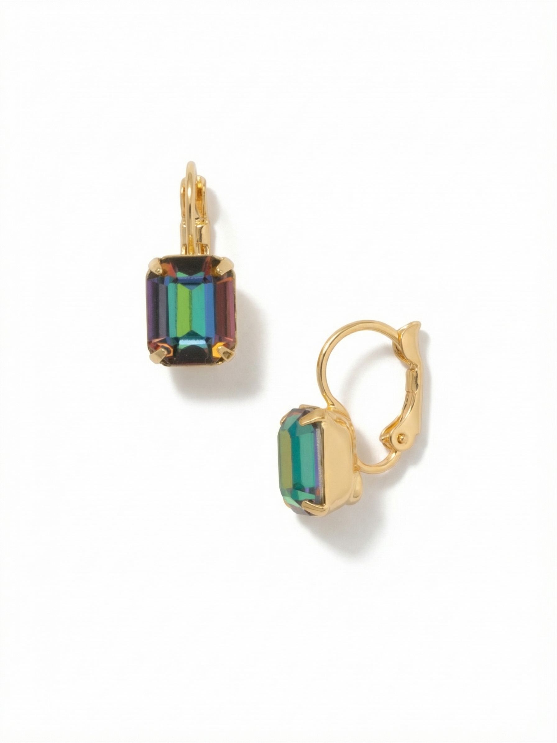 Octavia Dangle Earrings - EFK6BGVO - <p>A single emerald-cut crystal anchors this concise drop earring, balancing crisp geometry with shifting color. The iridescent stone transitions through deep greens, blues, and warm amber tones as you move. Suspended from a secure hinged closure, the stone stays close to the face to reflect the ambient light. The bright gold-tone setting provides a warm, clean frame that emphasizes the multicolored hues, creating a subtle but distinct focal point for your daily rotation.</p><ul>
<li>Clean emerald-cut profile highlights the iridescent color shifts</li>
<li>Compact drop proportion offers noticeable color without heavy weight</li>
<li>Hook drop for easy, lightweight wear</li>
<li>Protective e-coat finish for lasting wear</li>
<li>Includes signature organza pouch for gifting and travel</li>
</ul>