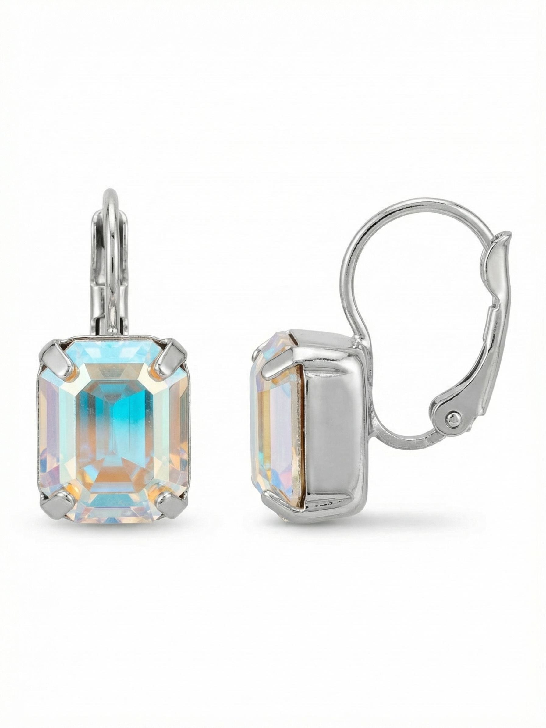 Octavia Dangle Earrings - EFK6PDCAB - <p>The step-cut facets of a single emerald-cut crystal create broad flashes of light with every turn of the head. Depending on the angle, the stone reveals unexpected shifts of cool blue, warm gold, and pale pink against a crisp silver-toned setting. Dropping just beneath the ear, this compact piece offers a quiet but persistent color shift that catches the eye across a table. The secure closure keeps the weight perfectly balanced and comfortable for all-day wear.</p><ul>
<li>Single emerald-cut crystal with clean step facets</li>
<li>Compact drop profile that creates subtle continuous movement</li>
<li>Hook drop for easy, lightweight wear</li>
<li>Protective e-coat finish for lasting wear</li>
<li>Includes signature organza pouch for gifting and travel</li>
</ul>