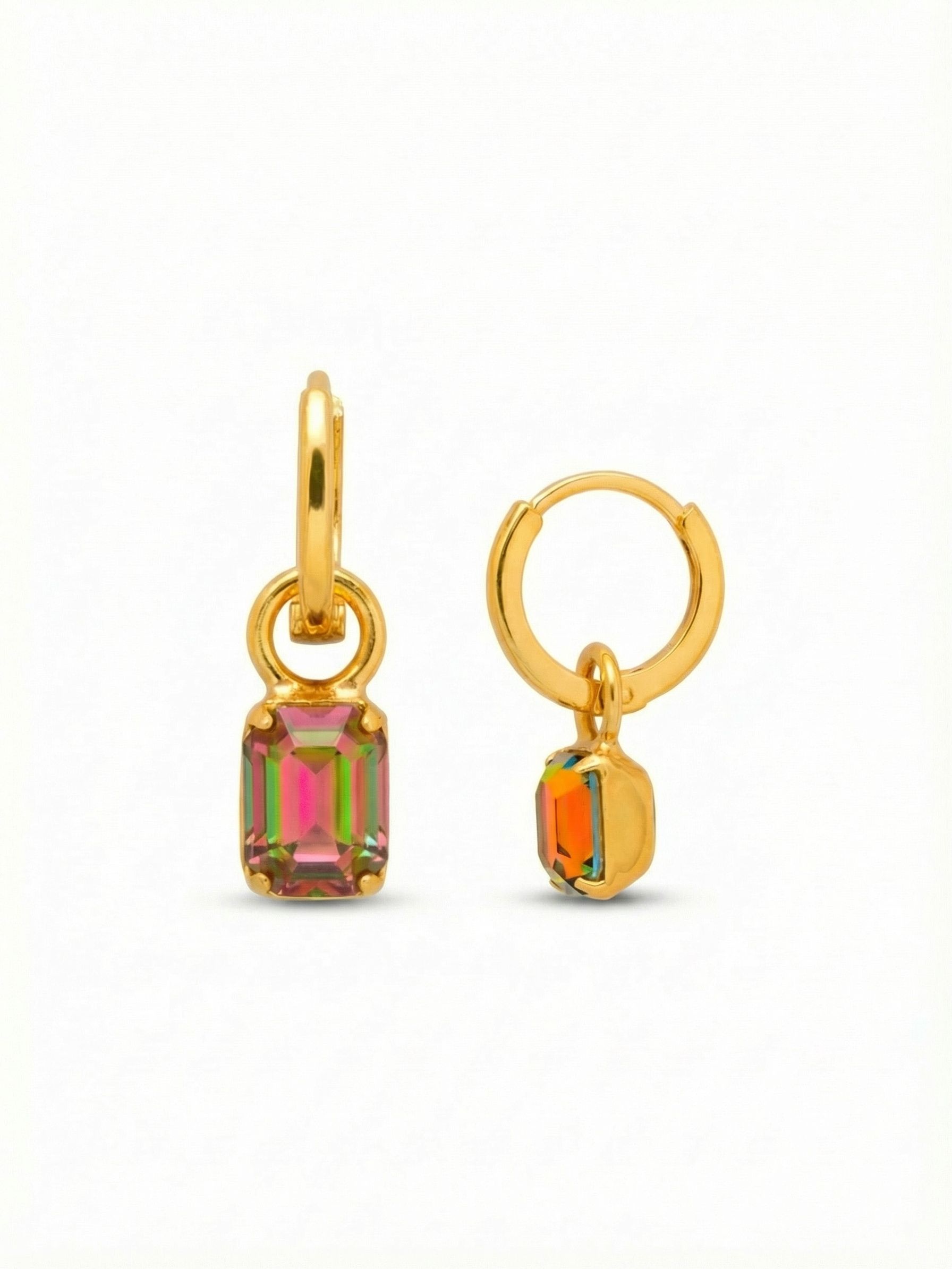Mini Emerald Huggie Hoop Earrings - EFM13BGVO - <p>A polished gold hoop rests comfortably close to the ear, grounding a single emerald-cut crystal that sways below. The free-moving drop catches the light with every subtle turn of the head, revealing a complex shift of magenta, green, and gold tones. Finished with a secure, seamless huggie closure, these compact earrings deliver an unexpected touch of iridescent color in a lightweight profile designed for all-day wear.</p><ul>
<li>Single emerald-cut crystal drop suspended from a polished hoop</li>
<li>Articulated jump ring allows the iridescent stone continuous subtle movement</li>
<li>Huggie hoop with click-shut closure</li>
<li>Protective e-coat finish for lasting wear</li>
<li>Includes signature organza pouch for gifting and travel</li>
</ul>