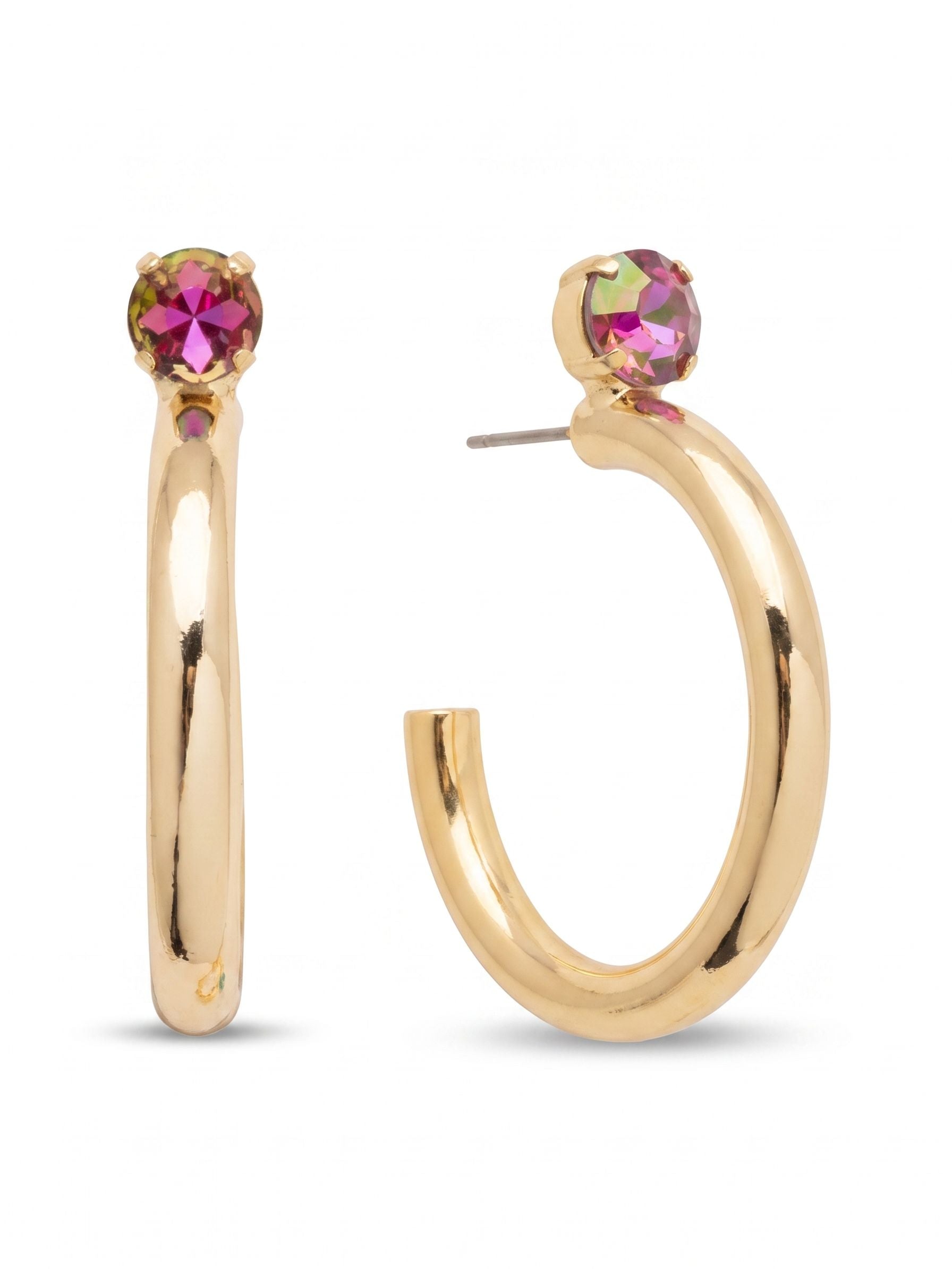 Keeley Studded Hoop Earrings - EFP26BGHEL - <p>A substantial take on the classic hoop. A single round-cut heliotrope crystal anchors the design close to your face, catching the light with rich pink and purple shifts. Below the crystal setting, thick metallic tubing drops into a wide, open curve that moves naturally as you turn your head. The polished metal offers a bold visual presence, while an oversized comfort clutch ensures this post design stays perfectly balanced and secure throughout your day.</p><ul>
<li>Thick open-hoop silhouette with a smooth metallic profile</li>
<li>Single round-cut crystal anchor creates a subtle pop of color</li>
<li>Hoop earring</li>
<li>Protective e-coat finish for lasting wear</li>
<li>Includes organza pouch for gifting and travel</li>
</ul>