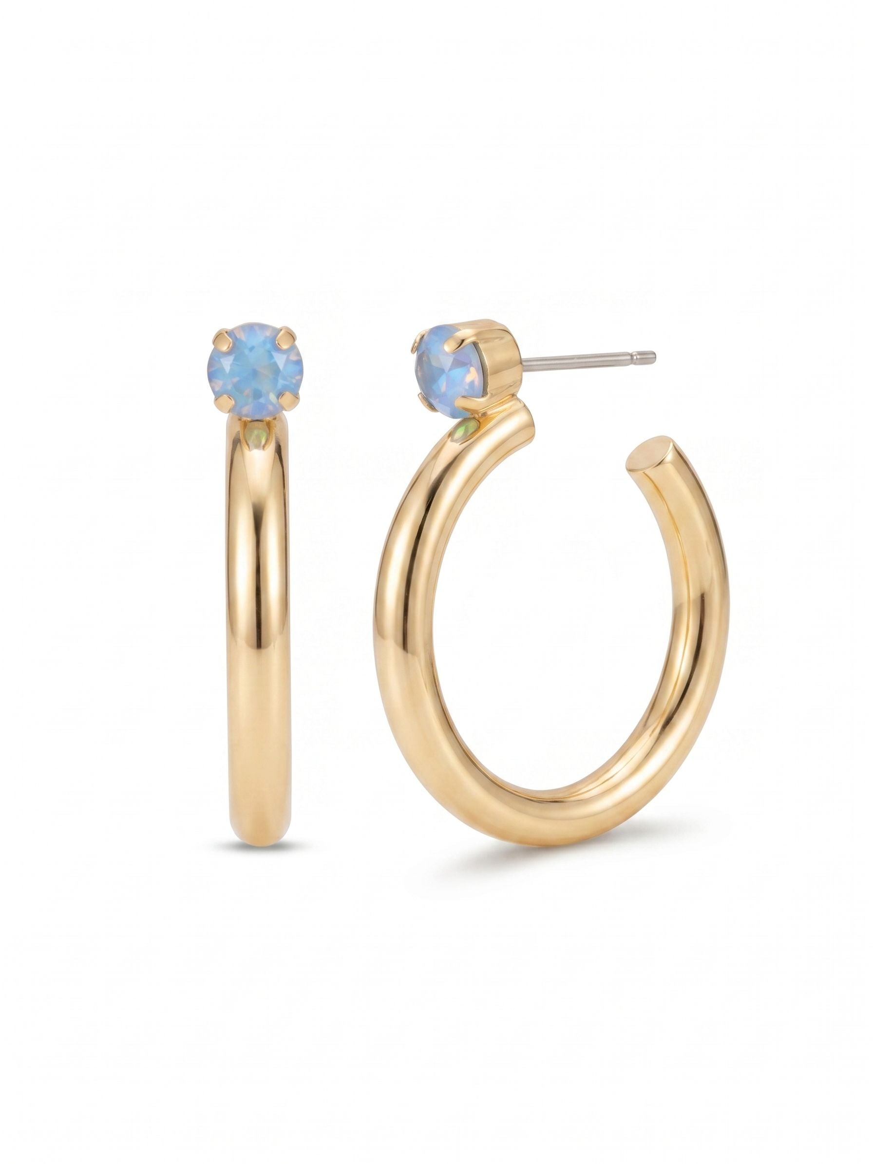 Keeley Studded Hoop Earrings - EFP26BGOCD - <p>A single, prominent round crystal anchors the top of this polished hoop, offering a sharp point of colored light against smooth metallic curves. At nearly two inches in length, these earrings provide substantial volume and movement to frame the face. The thick tubular construction keeps them comfortably weighted for daily wear, while the included oversized comfort clutch ensures the post stays secure and perfectly balanced from morning well into the evening.</p><ul>
<li>Thick tubular open-hoop silhouette</li>
<li>Singular oversized round-cut crystal accent at the post</li>
<li>Hoop earring</li>
<li>Protective e-coat finish for lasting wear</li>
<li>Includes signature organza pouch for gifting and travel</li>
</ul>
