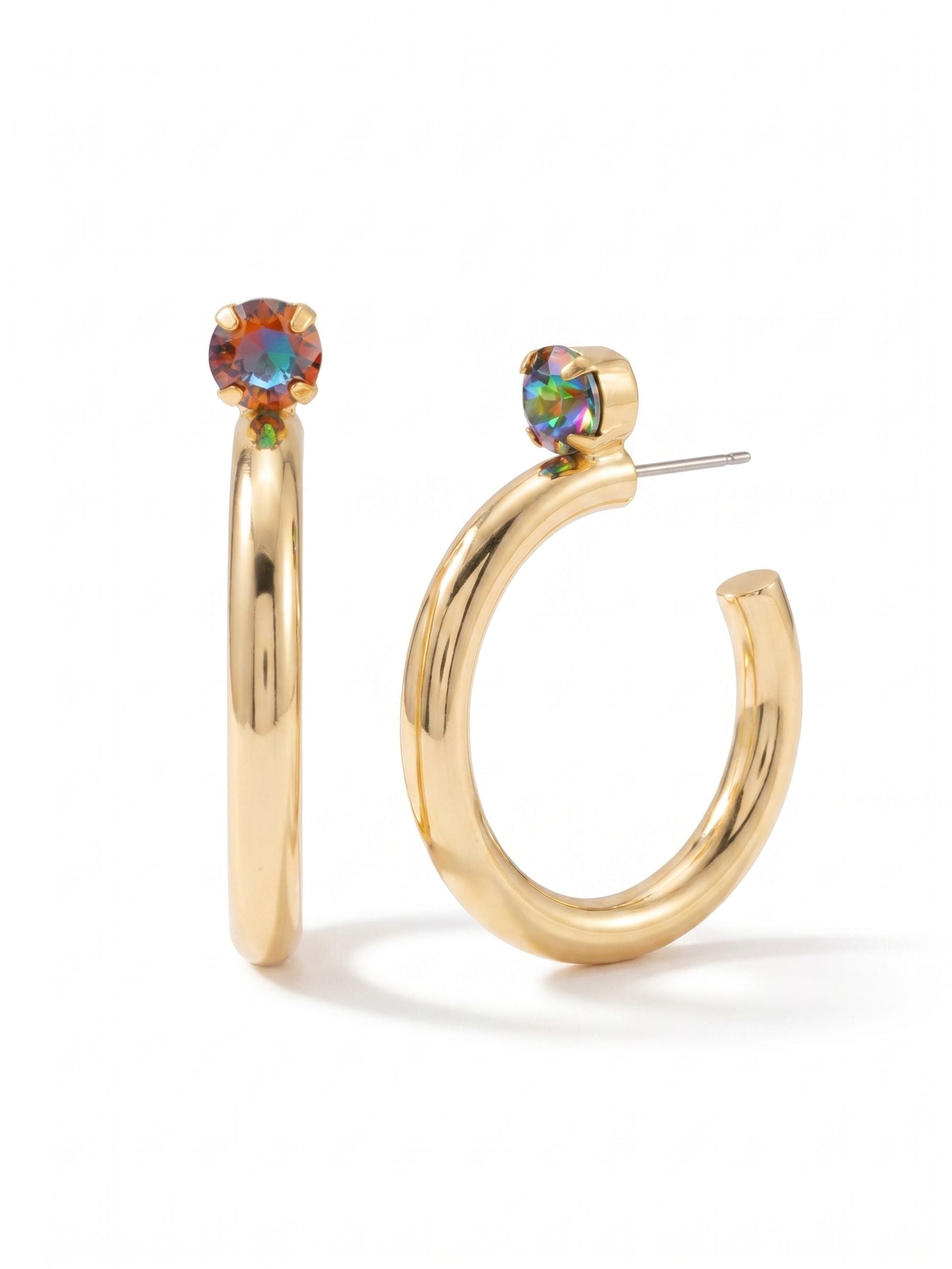 Keeley Studded Hoop Earrings - EFP26BGVO - <p>A modern update to the classic metallic hoop. A single round-cut crystal in fiery orange and violet rests right at the piercing point, anchoring a thick, polished gold-tone curve. The tubular shape catches the light evenly as you move. While the profile looks substantial, our oversized comfort clutch keeps the earring perfectly balanced and secure all day. It brings a grounded, warm flash of color to a crisp white shirt or a heavy knit.</p><ul>
<li>Solitaire color-shifting crystal set atop a sleek open hoop</li>
<li>Substantial polished metallic profile with a forward-facing silhouette</li>
<li>Hoop earring</li>
<li>Protective e-coat finish for lasting wear</li>
<li>Includes signature organza pouch for gifting and travel</li>
</ul>