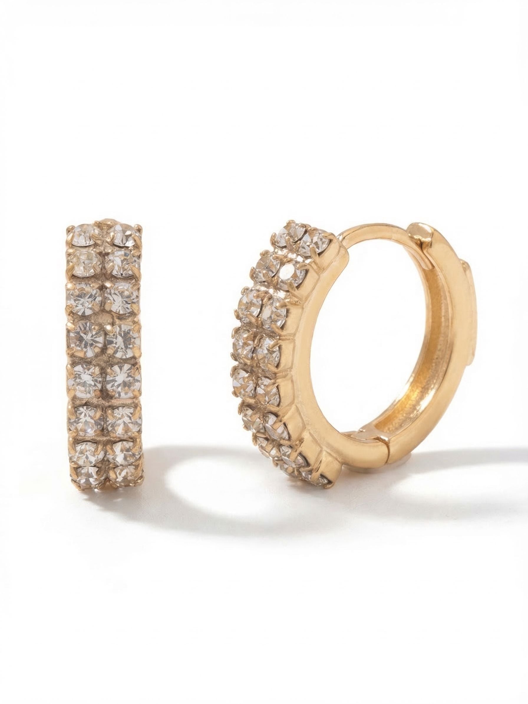 Double Crystal Huggie Hoop Earrings - EFS31BGCRY - <p>These small hoops sit close to the ear, bringing a clean band of light exactly where you want it. Two parallel rows of tiny crystals catch movement without adding weight, making them an easy choice for daily wear. The hinged closure snaps securely into place, offering a dependable fit you can put on and forget about. This is a quiet staple that holds its own whether worn solo or layered up the ear.</p><ul>
<li>Continuous double row of crystals creates a solid band of light</li>
<li>Hinged hoop with click-shut closure</li>
<li>Protective e-coat finish for lasting wear</li>
<li>Includes signature organza pouch for gifting and travel</li>
</ul>