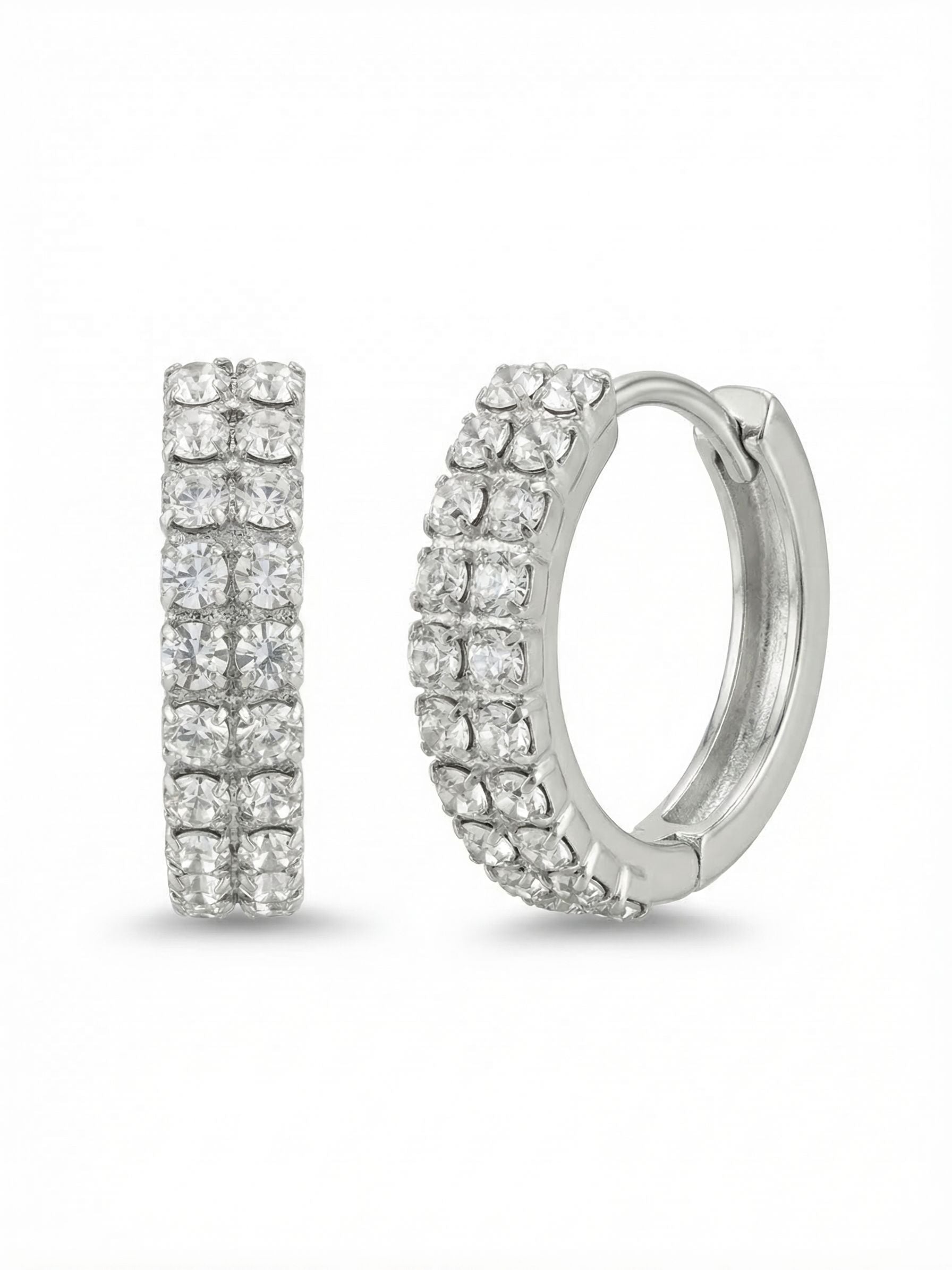 Double Crystal Huggie Hoop Earrings - EFS31PDCRY - <p>Two parallel rows of clear crystals catch the light with every subtle turn of the head. This compact hoop curves closely around the ear, delivering a structured double band of brilliance that feels entirely weightless. The hinged design snaps securely into place, offering an effortless wearing experience from morning until evening. It brings a continuous line of reflection that adds polished texture right next to the face.</p><ul>
<li>Twin rows of closely set crystals create a continuous band of structured light</li>
<li>Compact profile designed to trace the natural curve of the ear</li>
<li>Hinged hoop with click-shut closure</li>
<li>Protective e-coat finish for lasting wear</li>
<li>Includes signature organza pouch for gifting and travel</li>
</ul>