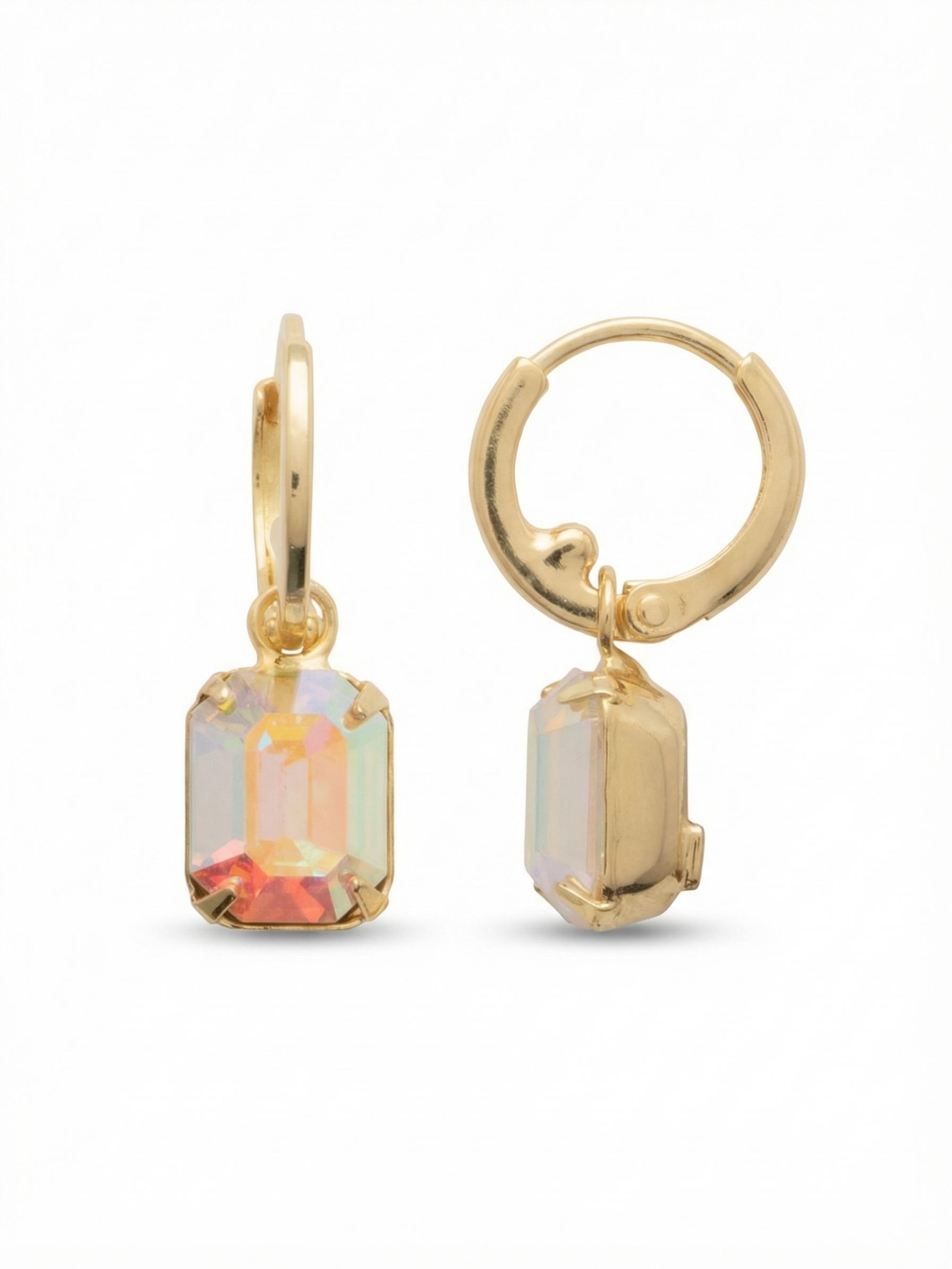 Octavia Huggie Hoop Earrings - EFS34BGCAB - <p>A smooth gold hoop anchors a single emerald-cut crystal that swings freely just below the ear. The iridescent Aurora Borealis stone catches the light with every subtle movement, shifting in color throughout the day. Because the huggie sits securely against the ear, the slight weight of the drop feels perfectly balanced and comfortable from morning to evening. It brings a clean, architectural geometry to an easy daily silhouette.</p><ul>
<li>Substantial emerald-cut drop crystal creates a clean architectural focal point</li>
<li>Articulated setting allows the iridescent stone to swing freely and catch the light</li>
<li>Huggie hoop with click-shut closure</li>
<li>Protective e-coat finish for lasting wear</li>
<li>Includes signature organza pouch for gifting and travel</li>
</ul>