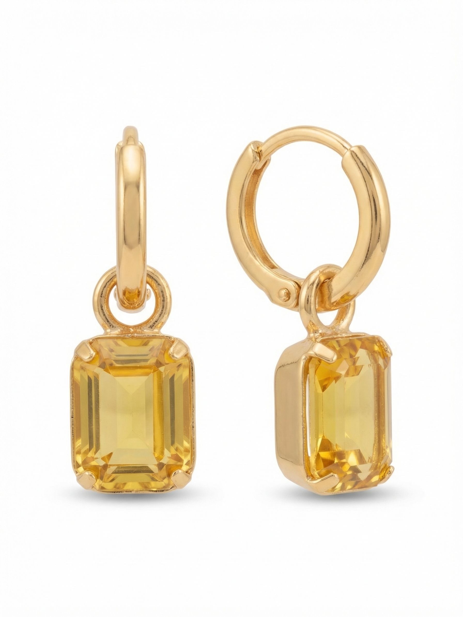Octavia Huggie Hoop Earrings - EFS34BGLTO - <p>A smooth metallic huggie hoop sits securely close to the ear, dropping a single emerald-cut crystal that catches the light as you move. The warm topaz stone swings freely on a simple jump ring, offering subtle flash and clean geometric lines without heavy volume. Designed with a hinge closure that clicks confidently into place, this lightweight piece transitions seamlessly through your day, bringing a quiet architectural presence to a very wearable scale.</p><ul>
<li>Suspended emerald-cut crystal provides subtle, fluid movement</li>
<li>Clean geometric profile highlights the stepped facets of the stone</li>
<li>Huggie hoop with click-shut closure</li>
<li>Protective e-coat finish for lasting wear</li>
<li>Includes signature organza pouch for gifting and travel</li>
</ul>