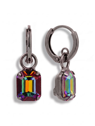 Octavia Huggie Hoop Earrings - EFS34GMVO - <p>A sleek gunmetal hoop anchors a single, saturated crystal drop. The emerald cut gives the stone a structured geometric presence, while the dark metallic setting deepens the shifting tones of vibrant green, warm amber, and violet. Attached by a simple ring, the crystal swings freely to catch the light with every movement. The hinged design provides a close, comfortable fit that holds securely all day without weighing you down.</p><ul>
<li>Suspended emerald cut crystal creates active movement and light play</li>
<li>Bold geometric stone shape contrasts with the circular hoop top</li>
<li>Huggie hoop with click-shut closure</li>
<li>Includes signature organza pouch for gifting and travel</li>
</ul>