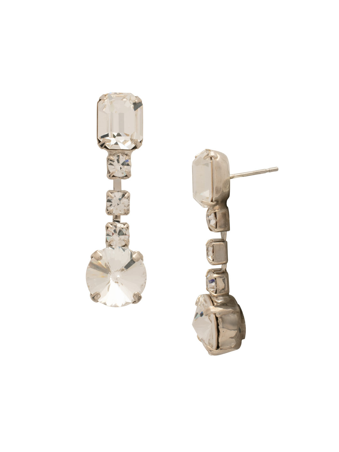 Bevy Dangle Earrings - EFT222PDCRY - <p>Elevate your look with the Bevy Dangle Earrings, showcasing a delicate emerald-cut crystal perched on a post, beautifully complemented by a shimmering rhinestone chain that leads to a striking round-cut crystal at the end. These earrings are the ideal blend of sophistication and charm. From Sorrelli's Crystal collection in our Palladium finish.</p>