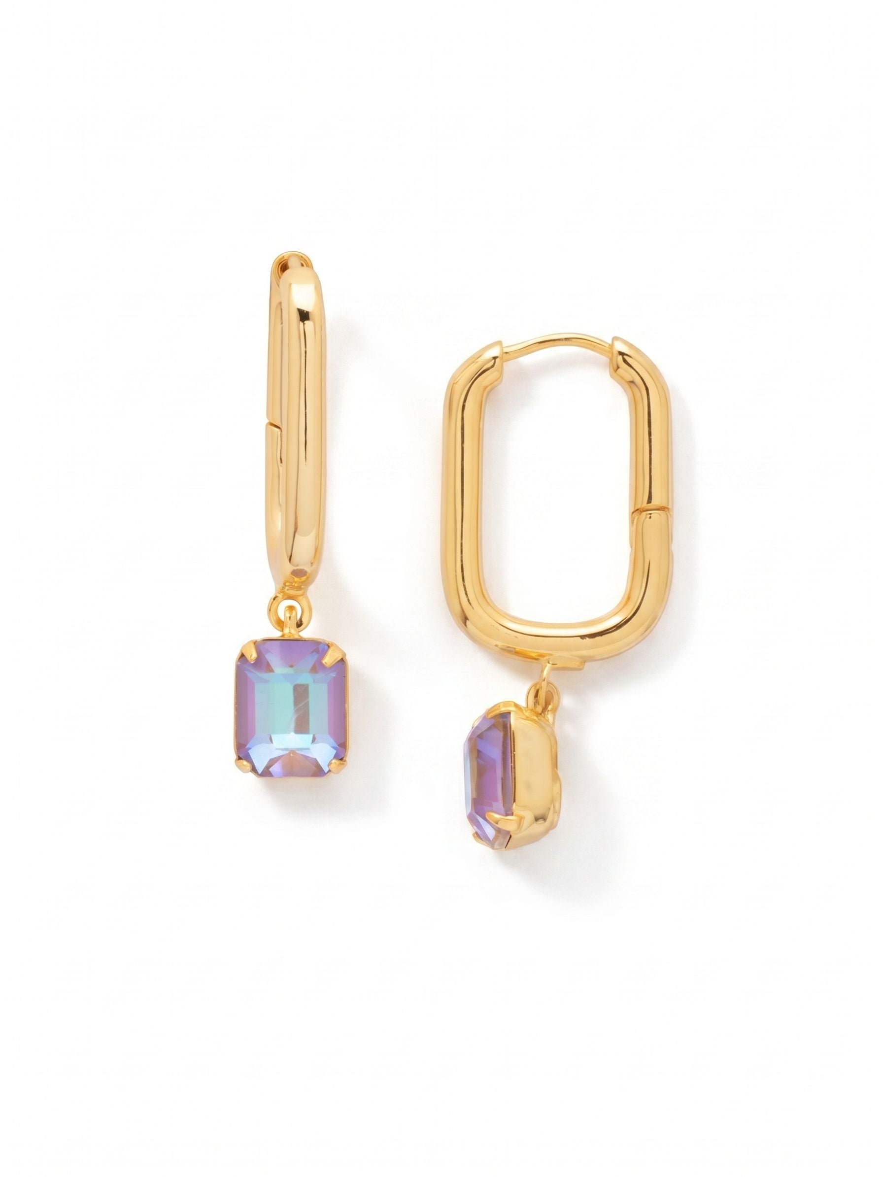 Octavia Rectangle Hoop Earrings - EFY7BGCPD - <p>The geometric profile of this elongated hoop brings quiet architectural structure to a familiar silhouette. Cast in polished metal, the rectangular shape frames the face while suspending a single emerald-cut crystal that catches shifting light with every turn of the head. The hinged design provides a secure fit that stays comfortable through long days. Offering just enough movement to draw the eye without feeling heavy, this piece naturally slips into a regular rotation.</p><ul>
<li>Elongated geometric hoop silhouette creates a structured framing effect</li>
<li>A single suspended emerald-cut crystal provides continuous movement and light</li>
<li>Hinged hoop with click-shut closure</li>
<li>Protective e-coat finish for lasting wear</li>
<li>Includes signature organza pouch for gifting and travel</li>
</ul>