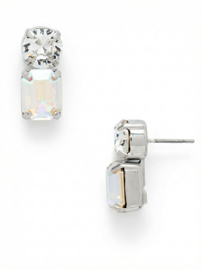 Zelie Dangle Earrings - EFZ2PDRQ - <p>A round clear crystal anchors this compact drop design, offering a crisp, brilliant flash right at the post. Just below, an emerald-cut Aurora Borealis crystal introduces a subtle shift in texture and color. The step-cut faceting catches prismatic light with every slight turn of the head. An articulated joint between the two stones ensures natural movement. Secured with an oversized comfort clutch back, the palladium setting holds its structure easily, keeping the crystals facing forward through the afternoon.</p><ul>
<li>Contrasting round brilliant and emerald-cut stones create varied light reflection</li>
<li>Articulated joint allows the bottom stone to shift smoothly in motion</li>
<li>Post with oversized comfort-clutch back</li>
<li>Protective e-coat finish for lasting wear</li>
<li>Includes signature organza pouch for gifting and travel</li>
</ul>
