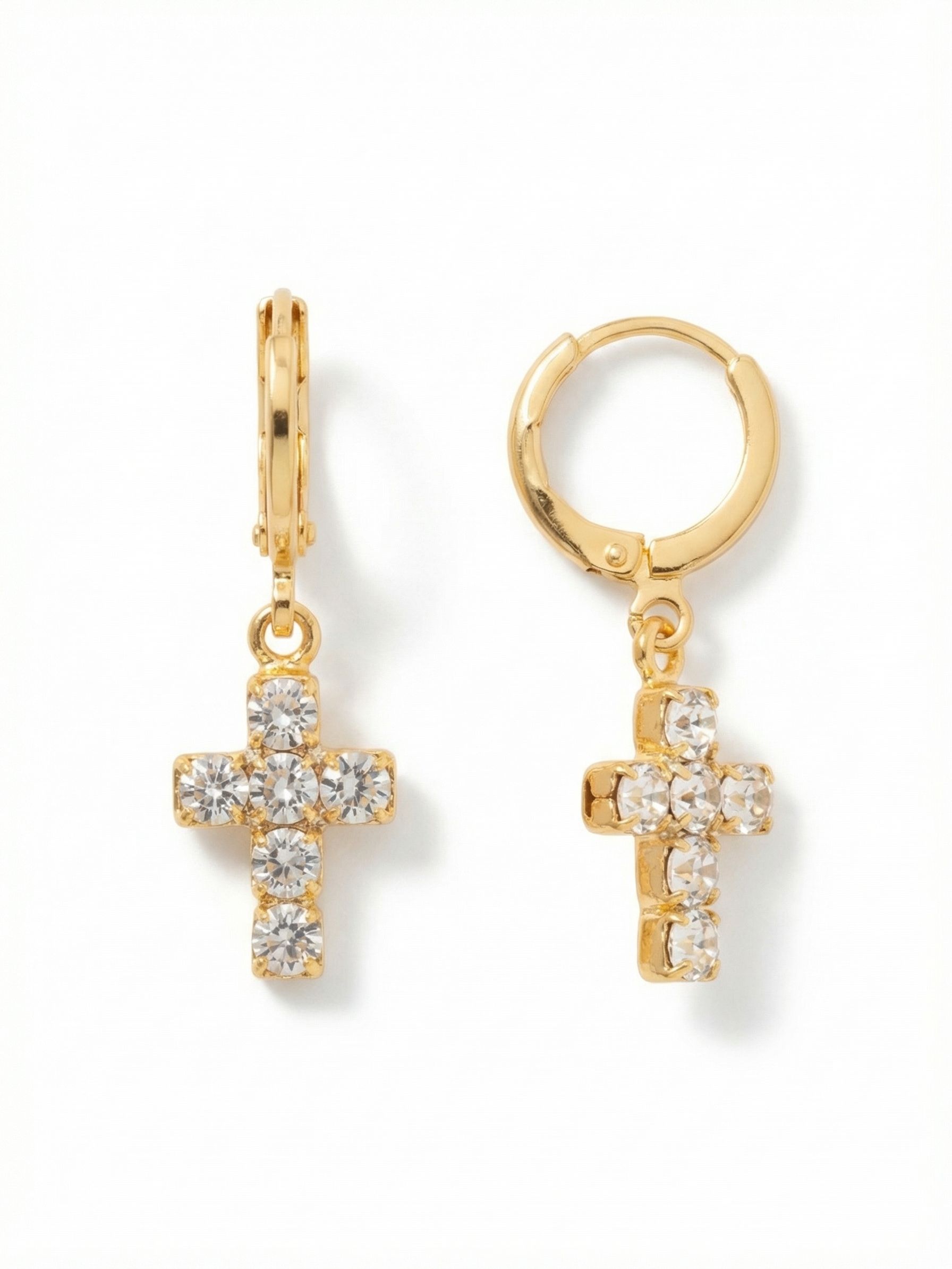 Carly Cross Huggie Hoop Earrings - EGE8BGCRY - <p>The polished hoop fastens closely around the ear, creating a secure foundation for daily wear. Suspended just below on a single link, a classic crystal cross catches the light with every turn of your head. The independent movement of the charm brings fluid animation to a familiar shape. It remains lightweight and easy, offering a clean flash of brightness that integrates seamlessly into your routine.</p><ul>
<li>Articulated pendant link creates fluid movement independent of the hoop</li>
<li>Closely set round crystals form a continuous line of brightness</li>
<li>Huggie hoop with click-shut closure</li>
<li>Protective e-coat finish for lasting wear</li>
<li>Includes signature organza pouch for gifting and travel</li>
</ul>