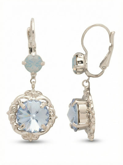 Lori Dangle Earrings - EGI4PDLTS - <p>An interplay of texture and light. These earrings pair a milky opalescent top crystal with a larger faceted pale blue drop. The bottom stone hangs freely from a simple hinge, allowing the cut surface to catch ambient room light as you walk. A delicately scrolled silver-tone frame surrounds the lower crystal, giving the piece a grounded architectural interest while remaining light enough for daily wear. The secure lever-back closure ensures the design stays balanced and comfortable.</p><ul>
<li>Contrasting opalescent and clear faceted pale blue crystals</li>
<li>Delicate scrolled metalwork frame around the main drop</li>
<li>Lever back closure for all-day secure wear</li>
<li>Pressure-fit comfort back</li>
<li>Protective e-coat finish for lasting wear</li>
<li>Includes signature organza pouch for gifting and travel</li>
</ul>