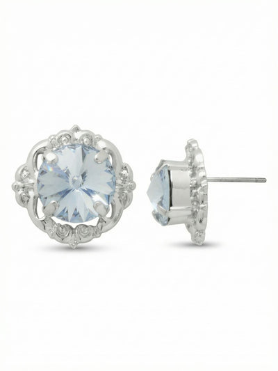 Lori Stud Earrings - EGI5PDLTS - <p>A substantial round crystal rests within a detailed metal frame to give these studs a defined presence. At half an inch wide, they read clearly across a table, catching and reflecting light through the pale blue center. The silver-toned setting adds a crisp brightness near the face. While they carry visual weight, an oversized comfort clutch keeps each earring secure and properly positioned from morning to night.</p><ul>
<li>Large central round stone anchored in a vintage-inspired scalloped frame</li>
<li>Open metal setting creates subtle dimension around the crystal</li>
<li>Post with oversized comfort-clutch back</li>
<li>Protective e-coat finish for lasting wear</li>
<li>Includes signature organza pouch for gifting and travel</li>
</ul>