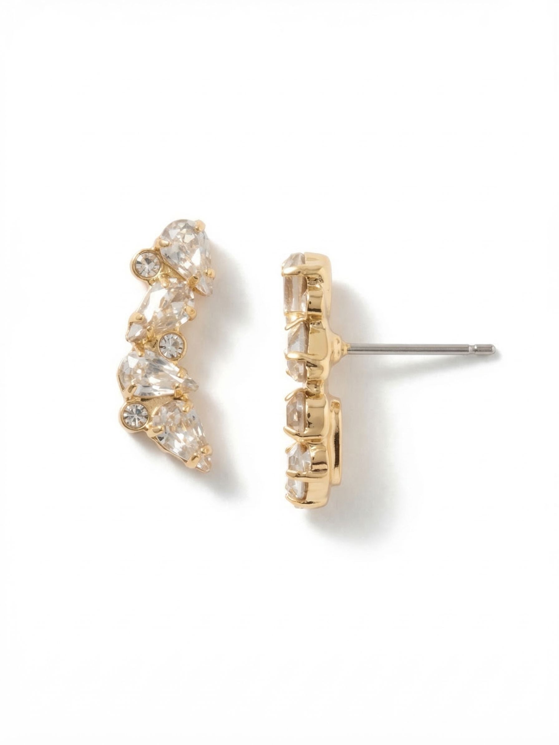 Eloise Stud Earrings - EGJ10BGCRY - <p>An arrangement of pear and round clear crystals traces a gentle curve on the ear. The bright gold-tone setting warms the clustered stones, catching the light easily as you move. At three-quarters of an inch long, this curved silhouette gives the look of a subtle climber while keeping the ease of a simple stud. An oversized comfort clutch back ensures the asymmetrical shape stays perfectly positioned and secure throughout your day.</p><ul>
<li>Curved silhouette mimics the modern look of an ear climber</li>
<li>Alternating pear and round crystals build a textured cluster</li>
<li>Post with oversized comfort-clutch back</li>
<li>Protective e-coat finish for lasting wear</li>
<li>Includes signature organza pouch for gifting and travel</li>
</ul>