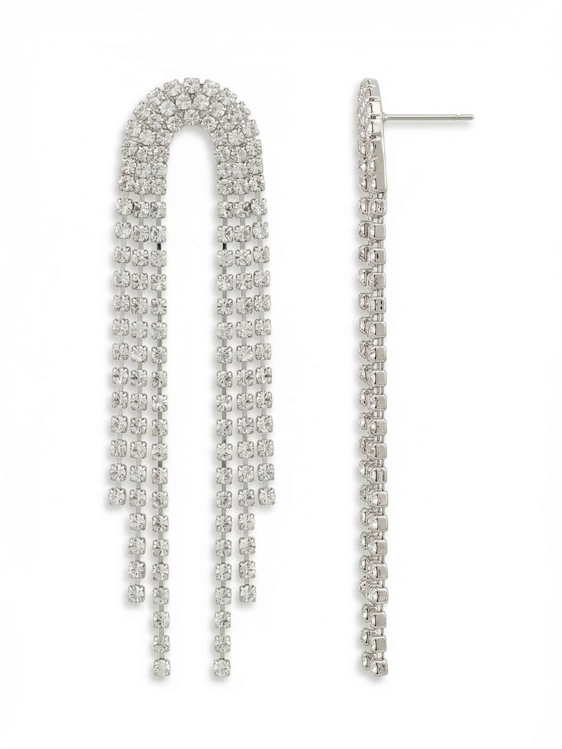 Arlyn Statement Earrings - EGJ2PDCRY - <p>Four unbroken lines of rhinestone chain form a structured arch at the post before descending into a fluid crystal fringe. At nearly four inches long, these earrings catch the light with every subtle movement. The flexible cup chain construction gives the cascade a liquid quality that sways effortlessly as you walk. To keep this generous length comfortably balanced, each post is secured with an oversized comfort clutch for hours of secure wear.</p><ul>
<li>Structured arch design transitioning into flowing crystal chain fringe</li>
<li>Four parallel strands of articulated cup chain for continuous light reflection</li>
<li>Post with oversized comfort-clutch back</li>
<li>Protective e-coat finish for lasting wear</li>
<li>Includes signature organza pouch for gifting and travel</li>
</ul>
