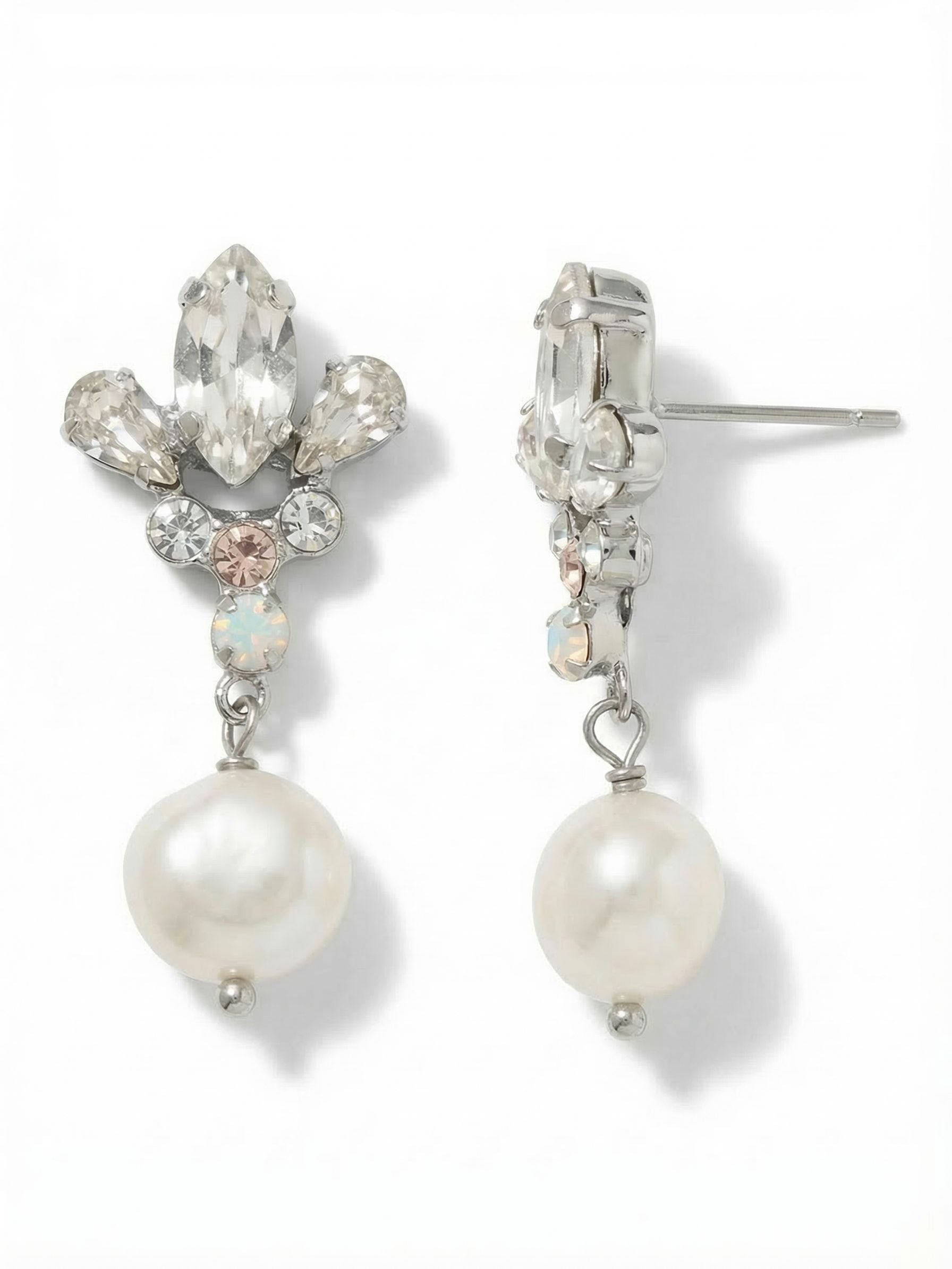 Tessa Dangle Earrings - EGJ3PDCLA - <p>A crisp marquise crystal anchors the post, surrounded by soft pear cuts and subtle accents of opal and warm silk. Below this structured cluster, a single pearl drops freely to catch the light as you move. The post closure is backed by an oversized comfort clutch, keeping the intricate top sitting perfectly flush and secure. At just over an inch long, they bring a distinct presence that transitions seamlessly from a tailored blazer to evening plans.</p><ul>
<li>Structured crystal cluster top anchored by a freely moving pearl drop</li>
<li>Mix of sharp marquise and soft pear cuts creates geometric balance</li>
<li>Post with oversized comfort-clutch back</li>
<li>Protective e-coat finish for lasting wear</li>
<li>Includes signature organza pouch for gifting and travel</li>
</ul>