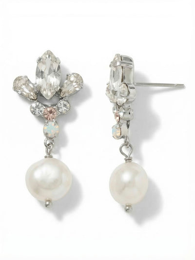 Tessa Dangle Earrings - EGJ3PDCLA - <p>A crisp marquise crystal anchors the post, surrounded by soft pear cuts and subtle accents of opal and warm silk. Below this structured cluster, a single pearl drops freely to catch the light as you move. The post closure is backed by an oversized comfort clutch, keeping the intricate top sitting perfectly flush and secure. At just over an inch long, they bring a distinct presence that transitions seamlessly from a tailored blazer to evening plans.</p><ul>
<li>Structured crystal cluster top anchored by a freely moving pearl drop</li>
<li>Mix of sharp marquise and soft pear cuts creates geometric balance</li>
<li>Post with oversized comfort-clutch back</li>
<li>Protective e-coat finish for lasting wear</li>
<li>Includes signature organza pouch for gifting and travel</li>
</ul>