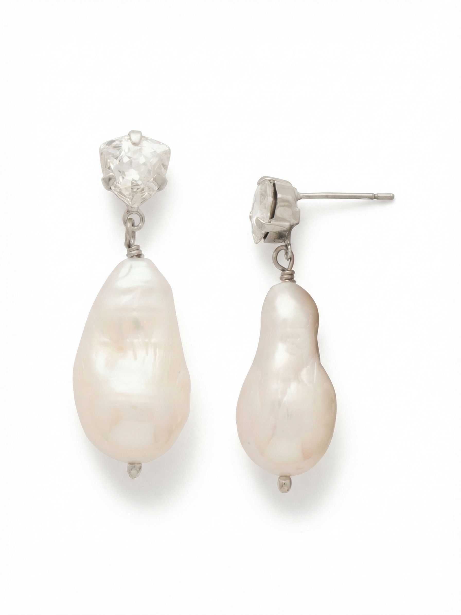 Sedge Pearl Dangle Earrings - EGJ4PDMDP - <p>A sharp trillion-cut crystal anchors these drop earrings, creating an immediate contrast against the organic shape of the baroque freshwater pearl suspended below. At just an inch long, they offer subtle movement that catches the light without feeling heavy. The articulated drop swings naturally as you turn your head. An oversized comfort clutch secures the post, ensuring the piece remains perfectly balanced and comfortable from morning until evening.</p><ul>
<li>Sharp geometric crystal contrasting with the soft irregularity of a baroque pearl</li>
<li>Articulated drop setting allowing the pearl to swing freely and catch ambient light</li>
<li>Post with oversized comfort-clutch back</li>
<li>Protective e-coat finish for lasting wear</li>
<li>Includes signature organza pouch for gifting and travel</li>
</ul>