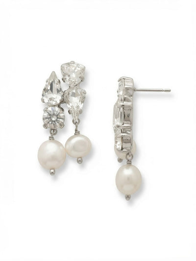 Charlotte Dangle Earrings - EGJ5PDMDP - <p>An intricate cluster of clear crystals anchors this modern drop, playing pear, trillion, and round cuts against one another to catch the light. The faceted arrangement sits securely on the ear, supported by an oversized comfort clutch that keeps the design balanced and comfortable all day. Beneath the crisp crystal architecture, twin white pearls swing freely. The contrast between sharp crystal facets and the soft, natural movement of suspended pearls brings a quiet vitality to your daily rotation.</p><ul>
<li>Asymmetrical cluster of pear, trillion, and round crystals</li>
<li>Twin pearls articulated to swing independently</li>
<li>Post with oversized comfort-clutch back</li>
<li>Protective e-coat finish for lasting wear</li>
<li>Includes signature organza pouch for gifting and travel</li>
</ul>