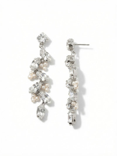 Hyacinth Statement Earrings - EGJ6PDMDP - <p>Sharp marquise cuts cascade downward, catching the light with every turn of the head. These elongated crystals are anchored on a flexible crystal-set chain, allowing the design to sway fluidly as you move. Clusters of miniature smooth pearls tuck between the sharp geometric stones, creating a quiet contrast of texture. At over two inches long, these drops command attention at conversation distance. They anchor securely in place with an oversized comfort clutch, keeping the weight gently balanced and the design sitting perfectly upright throughout the day.</p><ul>
<li>Fluid kette chain construction allows the crystal column to sway naturally</li>
<li>Sharp marquise-cut crystals contrasted with clusters of smooth pearl accents</li>
<li>Post with oversized comfort-clutch back</li>
<li>Protective e-coat finish for lasting wear</li>
<li>Includes signature organza pouch for gifting and travel</li>
</ul>