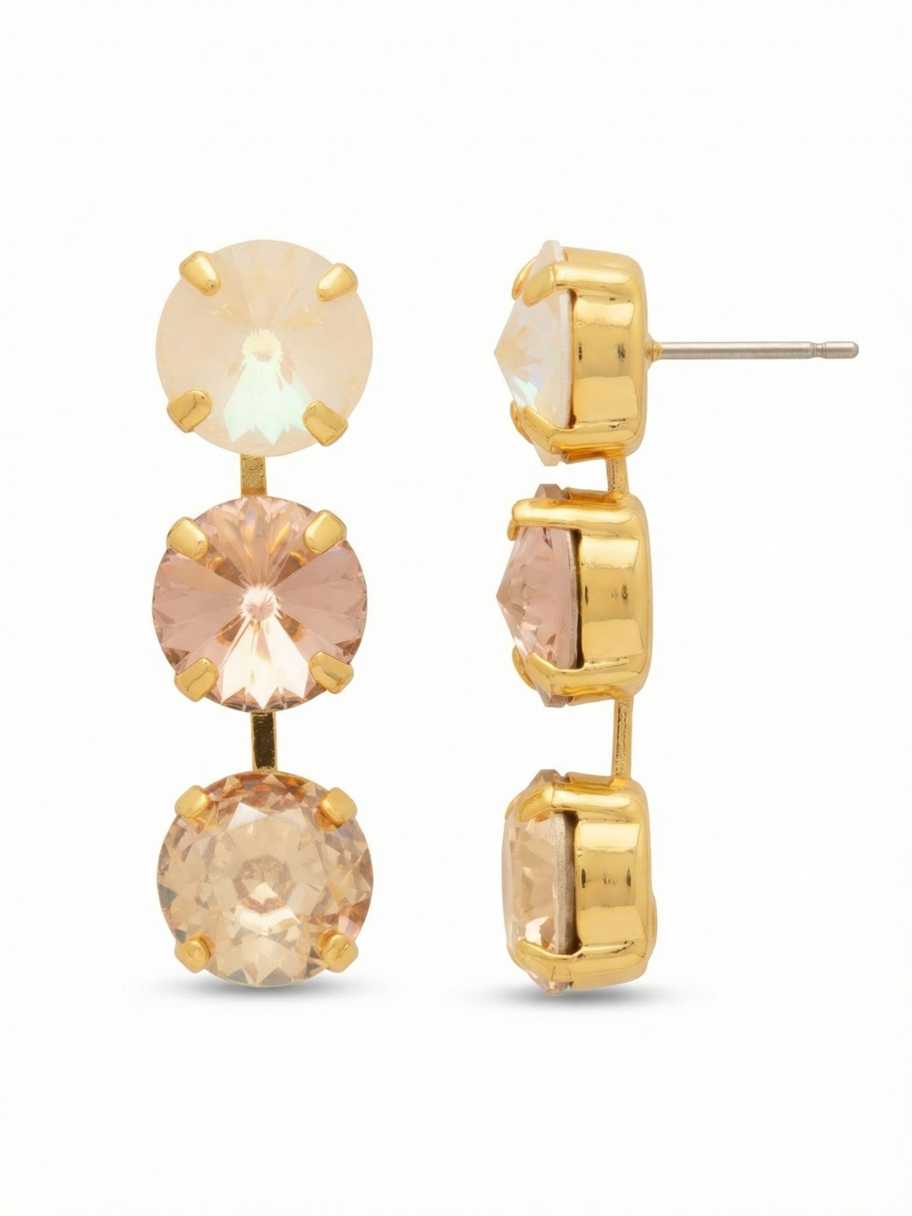 Mara Triple Dangle Earrings - EGK2BGGGO - <p>Three sizable round crystals cascade in a linear drop, catching light with every step. The stones shift gracefully from an iridescent top to a warm champagne base, amplifying the glow of the bright gold-tone setting. At nearly two inches long, they bring distinct presence and fluid movement. An oversized comfort clutch anchors the post securely, ensuring the weight feels balanced and effortless throughout the day.</p><ul>
<li>Linear gradient of three large round-cut crystals</li>
<li>Articulated metal links for fluid, natural movement</li>
<li>Post with oversized comfort-clutch back</li>
<li>Protective e-coat finish for lasting wear</li>
<li>Includes signature organza pouch for gifting and travel</li>
</ul>