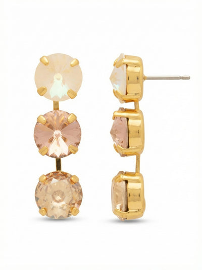 Mara Triple Dangle Earrings - EGK2BGGGO - <p>Three sizable round crystals cascade in a linear drop, catching light with every step. The stones shift gracefully from an iridescent top to a warm champagne base, amplifying the glow of the bright gold-tone setting. At nearly two inches long, they bring distinct presence and fluid movement. An oversized comfort clutch anchors the post securely, ensuring the weight feels balanced and effortless throughout the day.</p><ul>
<li>Linear gradient of three large round-cut crystals</li>
<li>Articulated metal links for fluid, natural movement</li>
<li>Post with oversized comfort-clutch back</li>
<li>Protective e-coat finish for lasting wear</li>
<li>Includes signature organza pouch for gifting and travel</li>
</ul>
