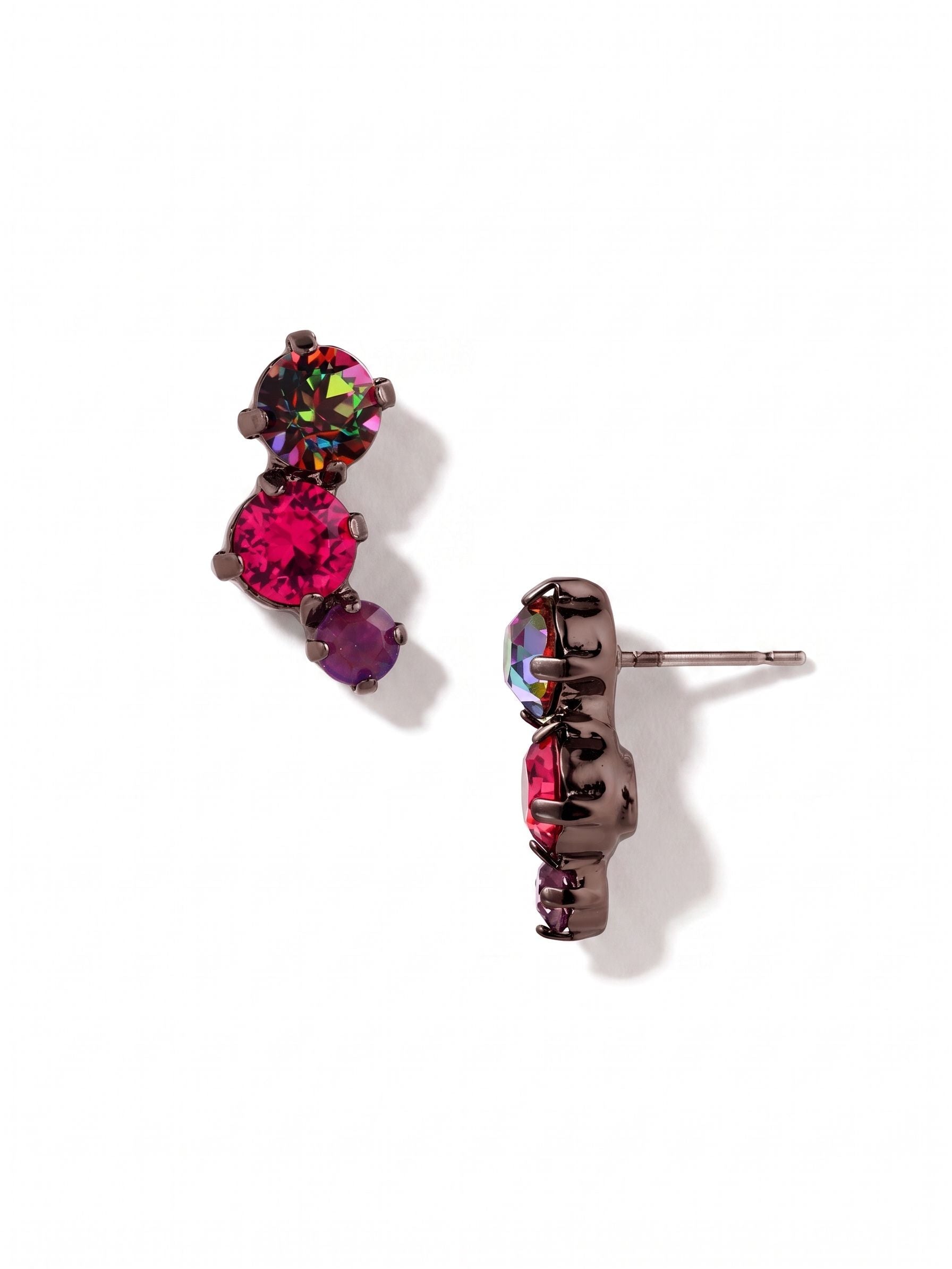 Bubbles Stud Earrings - EGK30GMNNI - <p>Three vibrant round crystals curve slightly upward in an asymmetrical arc. Shifting tones of iridescent volcano and bright fuchsia play against a dark metal setting, bringing unexpected depth to a classic stud profile. At three-quarters of an inch long, this design offers the visual presence of a small drop while staying close to the face. An oversized pressure-fit comfort clutch keeps the clustered arrangement perfectly balanced and securely anchored from morning to night.</p><ul>
<li>Asymmetrical stacked arrangement creates a subtle curved silhouette</li>
<li>Rich contrast between bright pink and dark iridescent stones</li>
<li>Post with oversized comfort-clutch back</li>
<li>Includes signature organza pouch for gifting and travel</li>
</ul>