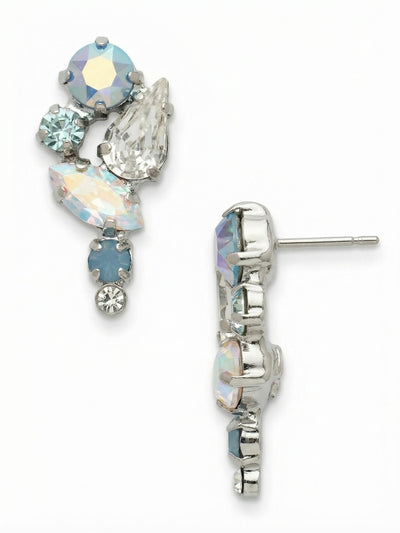 Monday Dangle Earrings - EGK4PDRQ - <p>An asymmetrical cluster of icy blue opals and iridescent crystals catches the light with every turn of your head. The deliberate mix of pear, marquise, and round cuts creates a subtle visual rhythm, throwing cool, shifting tones that quietly illuminate the face. While the arrangement brings significant texture and presence, the post design wears effortlessly all day, anchored close to the skin by an oversized comfort clutch that keeps the weight perfectly balanced.</p><ul>
<li>Asymmetrical cascade of mixed round, pear, and marquise crystals</li>
<li>Opalescent blue tones that shift dynamically in natural light</li>
<li>Post with oversized comfort-clutch back</li>
<li>Protective e-coat finish for lasting wear</li>
<li>Includes signature organza pouch for gifting and travel</li>
</ul>