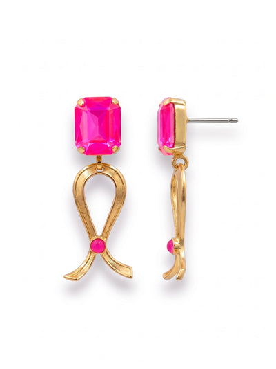Ribbon of Hope Dangle Earrings - EGM2BGETP - <p>A single emerald-cut pink crystal anchors this earring, catching light through clean, geometric facets. Below it swings a textured metal ribbon, pinned at the center with a subtle round crystal. At an inch and a half long, the sculptural drops provide a pleasing weight while remaining easy to wear from morning until evening. The post closure includes an oversized comfort clutch, keeping the large rectangular stones positioned securely upright so they stay comfortably balanced in motion.</p><ul>
<li>Emerald-cut crystal anchoring a textured, free-swinging metal ribbon</li>
<li>Striking interplay of clean geometric facets and sculpted metallic texture</li>
<li>Post with oversized comfort-clutch back</li>
<li>Protective e-coat finish for lasting wear</li>
<li>Includes organza pouch for gifting and travel</li>
</ul>