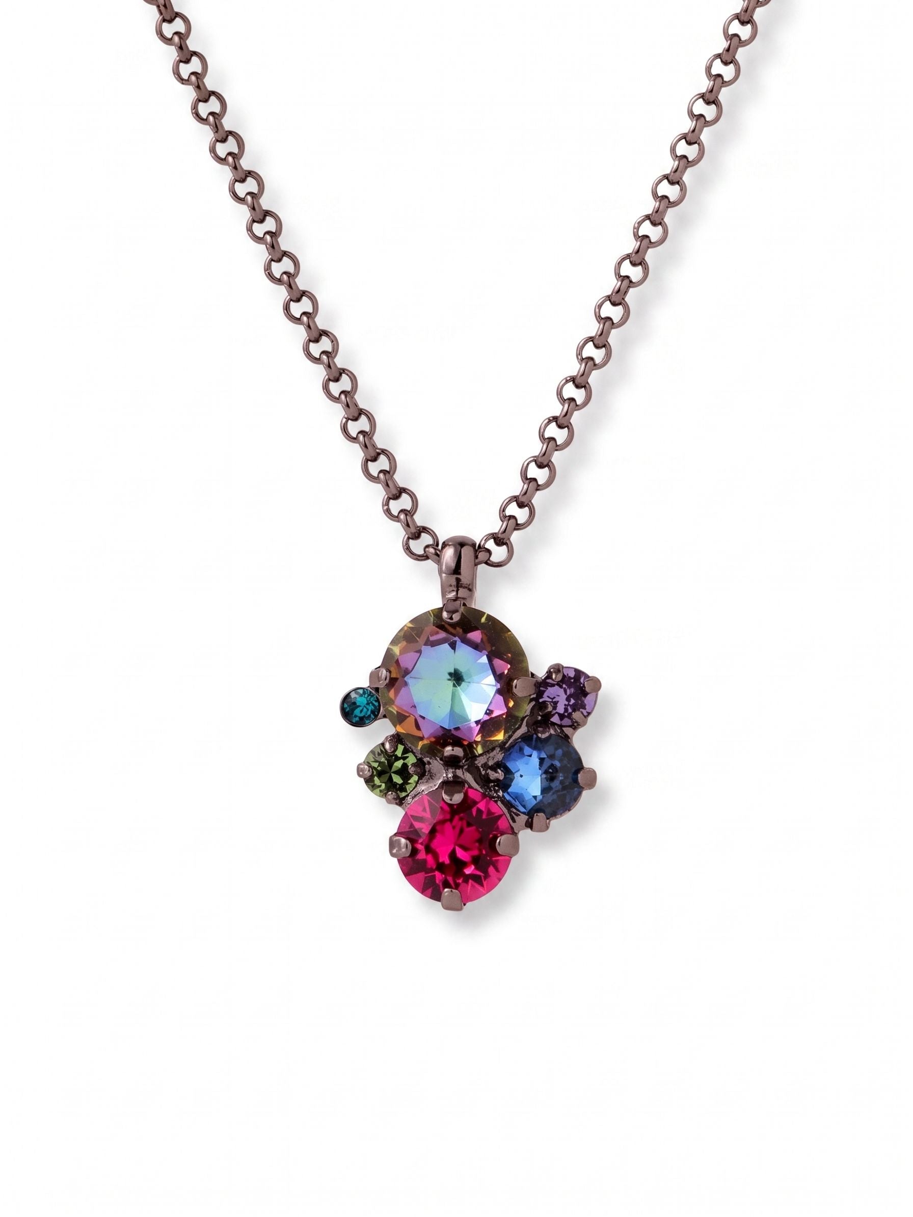 Crystal Assorted Rounds Pendant Necklace - NDB111GMNNI - <p>Six round crystals cluster in an asymmetrical arrangement to anchor this pendant necklace. The saturated mix of fuchsia, iridescent tones, and deep greens stands out against the dark gunmetal setting, catching the light with a moody depth. Suspended from a substantial rolo chain, the piece finds a natural resting point just below the collarbone. The included extension chain lets you alter the drop length, making it easy to adjust the placement for different necklines.</p><ul>
<li>Asymmetrical cluster design combining six distinct crystal sizes and colors</li>
<li>Substantial rolo chain balances the visual weight of the center arrangement</li>
<li>Lobster claw clasp</li>
<li>4-inch adjustable extension chain</li>
<li>Includes signature organza pouch for gifting and travel</li>
</ul>