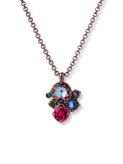 Crystal Assorted Rounds Pendant Necklace - NDB111GMNNI - <p>Six round crystals cluster in an asymmetrical arrangement to anchor this pendant necklace. The saturated mix of fuchsia, iridescent tones, and deep greens stands out against the dark gunmetal setting, catching the light with a moody depth. Suspended from a substantial rolo chain, the piece finds a natural resting point just below the collarbone. The included extension chain lets you alter the drop length, making it easy to adjust the placement for different necklines.</p><ul>
<li>Asymmetrical cluster design combining six distinct crystal sizes and colors</li>
<li>Substantial rolo chain balances the visual weight of the center arrangement</li>
<li>Lobster claw clasp</li>
<li>4-inch adjustable extension chain</li>
<li>Includes signature organza pouch for gifting and travel</li>
</ul>