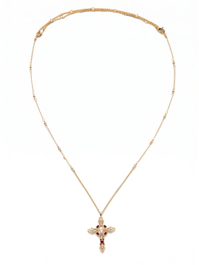 Elowen Pendant Necklace - NDS3BGSRC - <p>A thirty-two inch chain creates a sweeping vertical line, dropping this intricate pendant low on the torso for an elongated drape. The design balances a central cushion-cut crystal with delicate pear shapes, punctuated by deep red Siam accents that draw the eye. Small metallic beads spaced along the chain add subtle texture that catches the light in motion. The generous length lends a natural sense of ease, anchoring layered chains or bringing distinct character to a simple knit.</p><ul>
<li>Structured arrangement of pear and cushion cut crystals creates an intricate geometric silhouette</li>
<li>Delicate bead accents along the chain provide subtle texture and catch the light</li>
<li>Lobster claw clasp</li>
<li>Protective e-coat finish for lasting wear</li>
<li>Includes signature organza pouch for gifting and travel</li>
</ul>