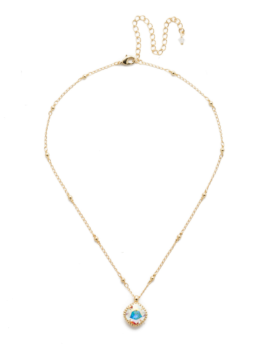 Cushion-Cut Pendant Necklace - NDS50BGCAB - <p>Elevate your jewelry collection with this artisanally handcrafted pendant necklace. The solitaire 12mm cushion cut crystal is surrounded by a beautifully scalloped edge, creating a unique and eye-catching design. The little ball details along the chain add a touch of character. This adjustable necklace features a 16 inch chain with a 4 inch extension, complete with a delicate charm, for a versatile fit. Whether you're looking for a special gift or a treat for yourself, this handcrafted necklace is a stylish and timeless choice. From Sorrelli's Crystal Aurora Borealis collection in our Bright Gold-tone finish.</p>