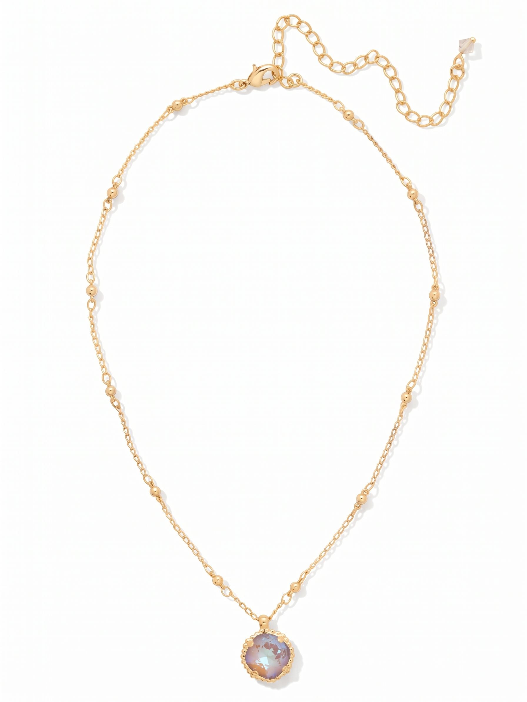 Cushion-Cut Pendant Necklace - NDS50BGCPD - <p>A single cushion-cut crystal grounds this pendant, resting gently at the collarbone. The warm Cappuccino Delite stone works seamlessly as an everyday signature. We suspended it from a delicate cable chain dotted with tiny gold-tone beads, adding a subtle visual rhythm along the neckline. The included extension lets you alter the drop, allowing the crystal to sit exactly where you want it whether worn alone or layered in an open collar.</p><ul>
<li>Delicate cable chain accented with polished bead stations</li>
<li>Textured scalloped metalwork borders the center stone</li>
<li>Lobster claw clasp</li>
<li>4-inch adjustable extension chain</li>
<li>Protective e-coat finish for lasting wear</li>
<li>Includes signature organza pouch for gifting and travel</li>
</ul>
