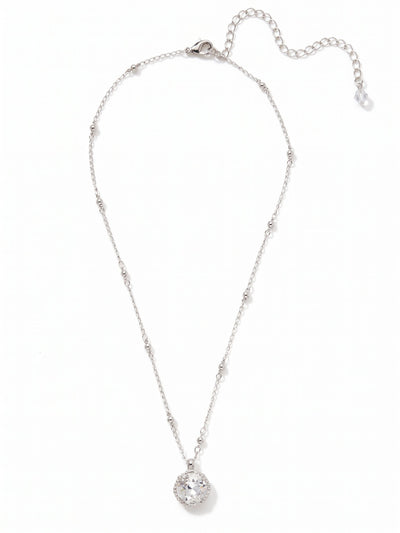 Cushion-Cut Pendant Necklace - NDS50PDCRY - <p>A single, substantial cushion-cut crystal anchors this necklace, drawing light directly to the collarbone. The stone is suspended from a delicate mixed-link chain, where polished metallic beads break up the traditional cable pattern to catch the light from multiple angles. It has a quiet presence that layers easily with other delicate pieces or stands perfectly well on its own. An adjustable extension allows you to tailor the drape to suit your neckline.</p><ul>
<li>Substantial cushion-cut focal crystal creates a distinct center point</li>
<li>Interspersed metallic beads add subtle texture to the delicate cable chain</li>
<li>Lobster claw clasp</li>
<li>4-inch adjustable extension chain</li>
<li>Protective e-coat finish for lasting wear</li>
<li>Includes signature organza pouch for gifting and travel</li>
</ul>